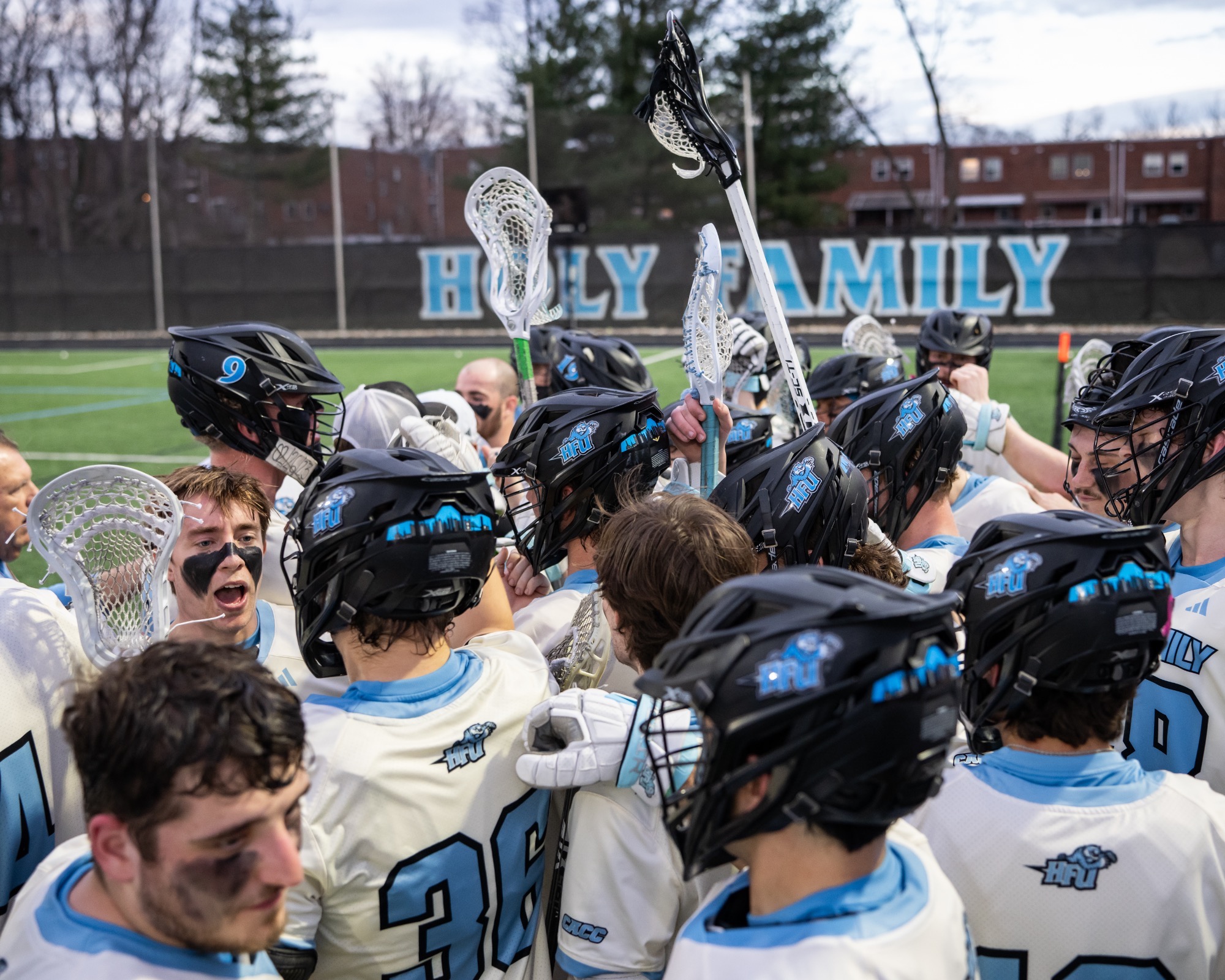 The HFU Men's Lacrosse Team huddles up prior to a match