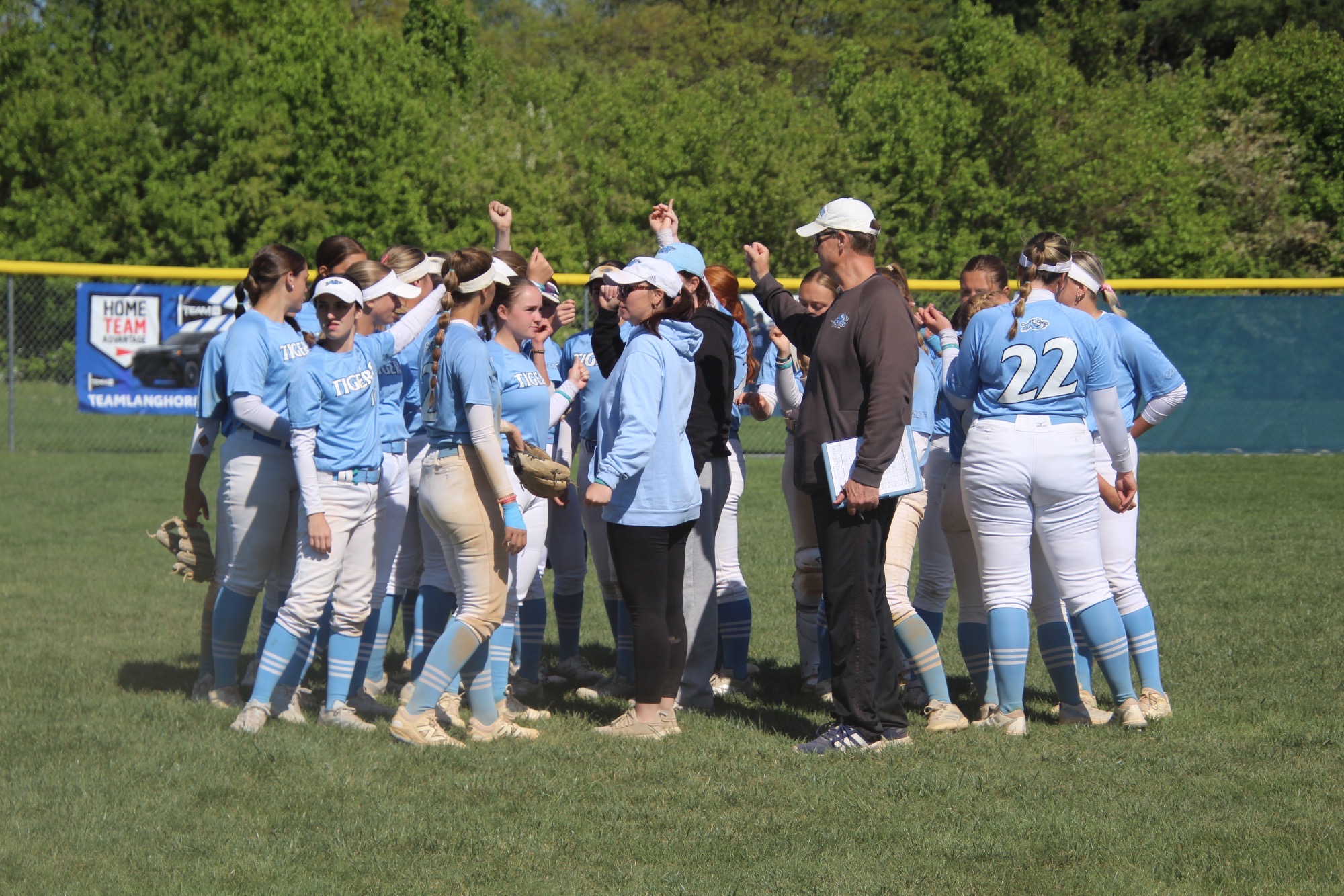 The HFU Softball breaks from a postgame huddle