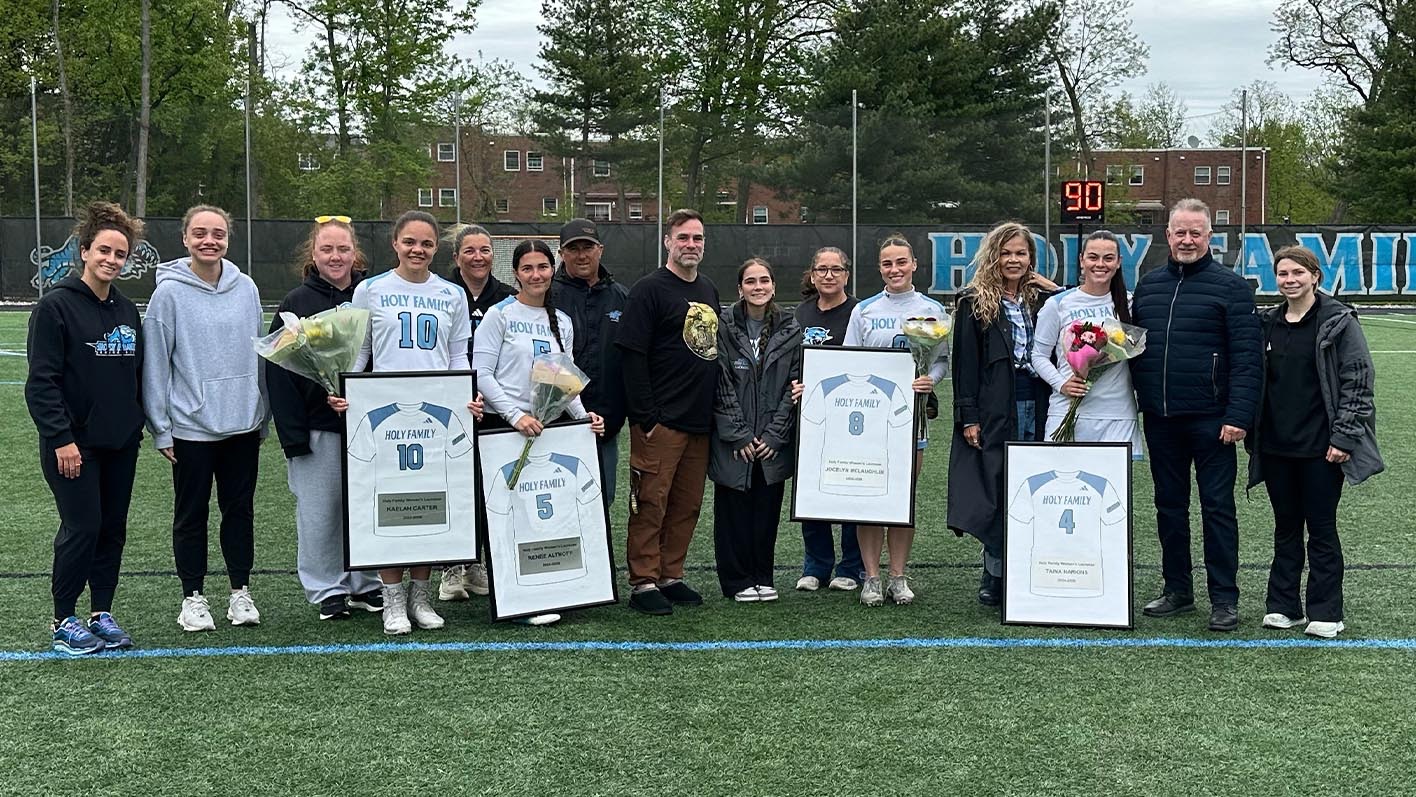 A group picture of the HFU Women's Lacrosse Class of 2026 with family and coaches