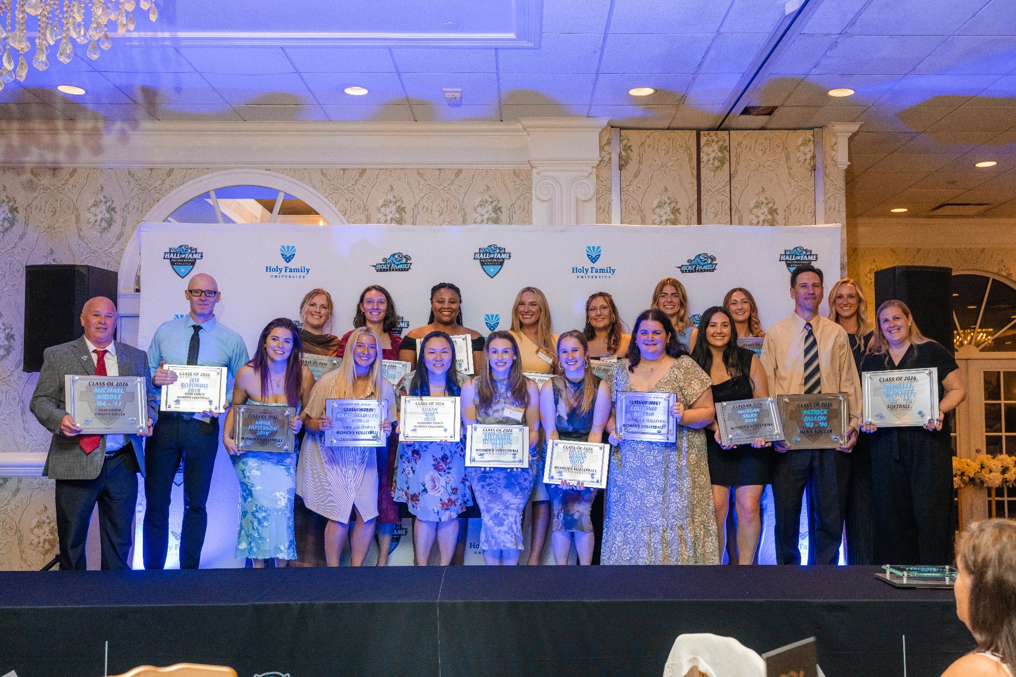 A group pictures of the 2026 HFU Athletics Hall of Fame class on stage at the Buck Hotel