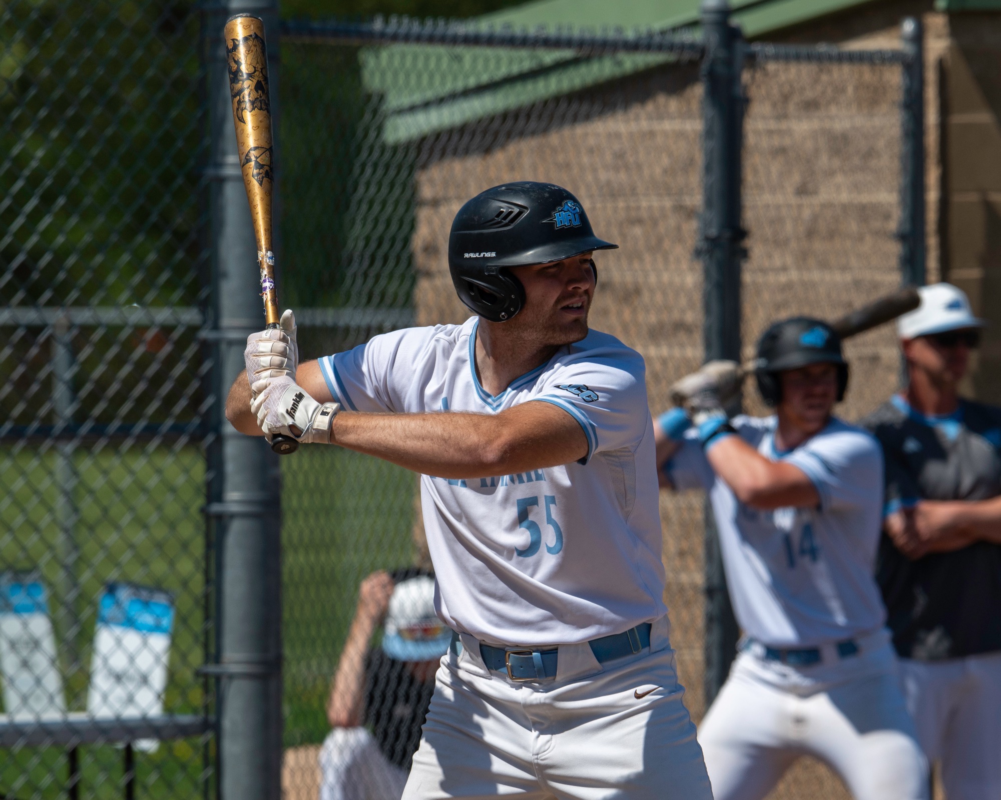 A closeup of Torin McKenzie in the right-handed batter's box as he prepares for a pitch to be thrown 
