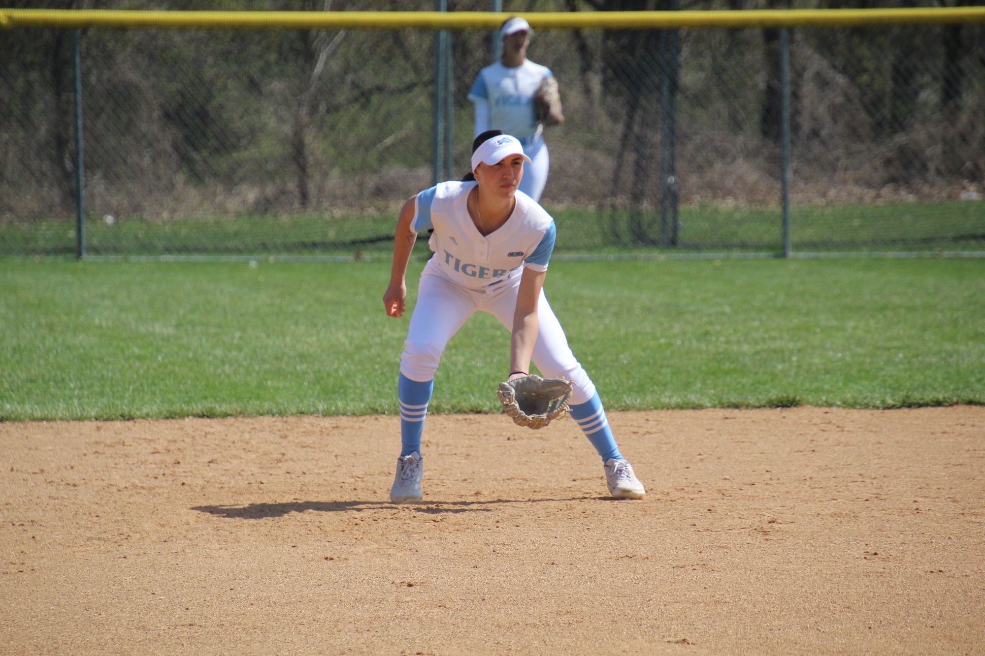 Second baseman Franceska Celebre enters a ready position as a pitch is about to be thrown