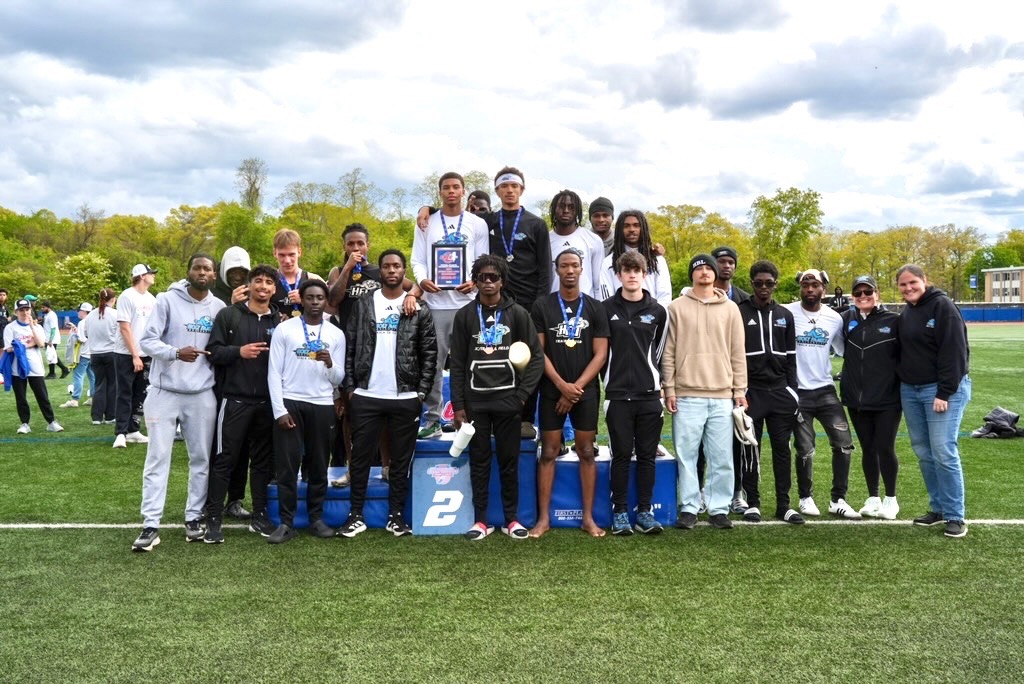 The HFU Men's Track & Field Team poses with the runner-up plaque after the 2026 CACC Championships