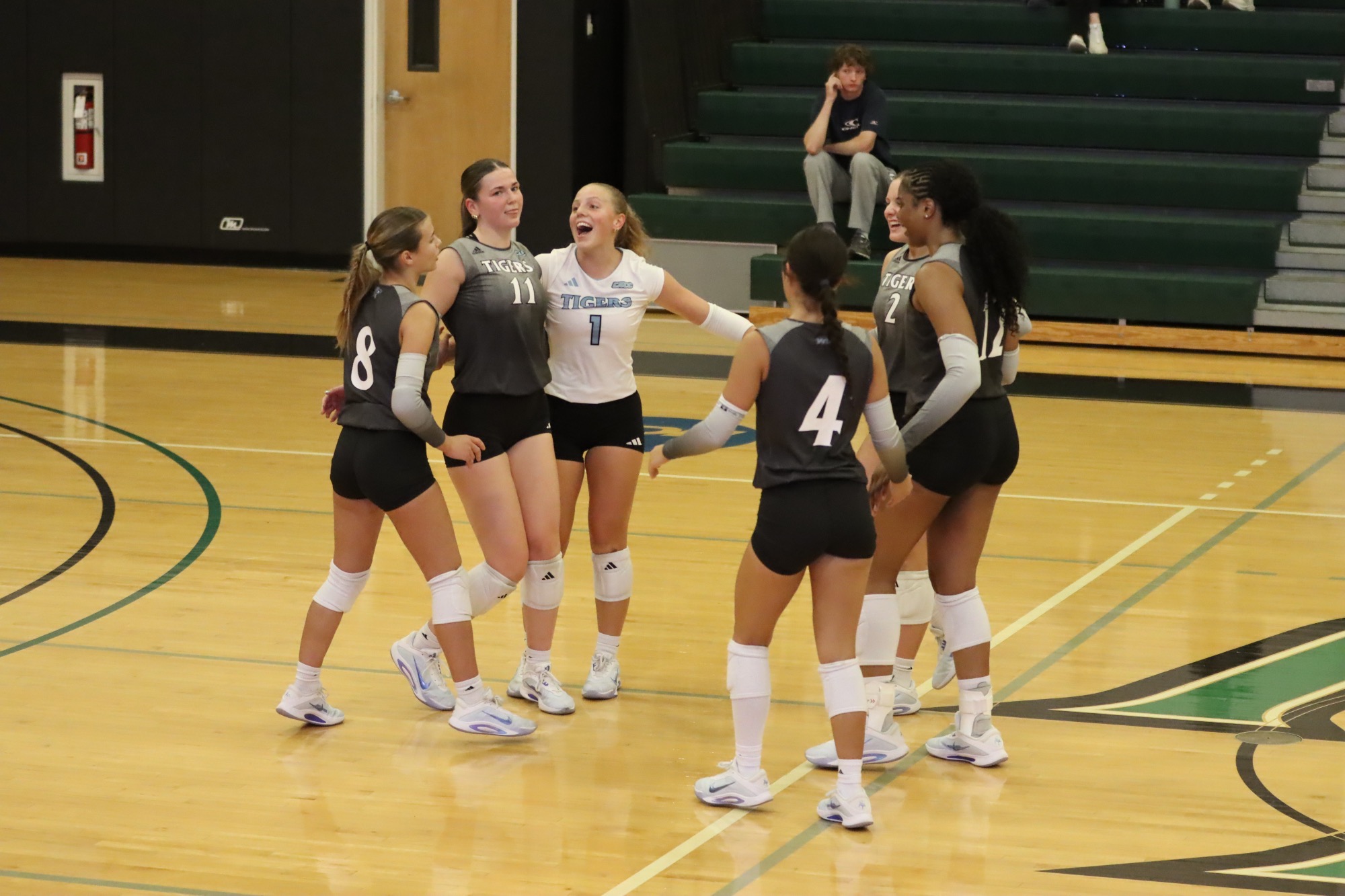 HFU Volleyball celebrates on the court after scoring a point at the 2026 Wilmington Wildcat Regional Invitational