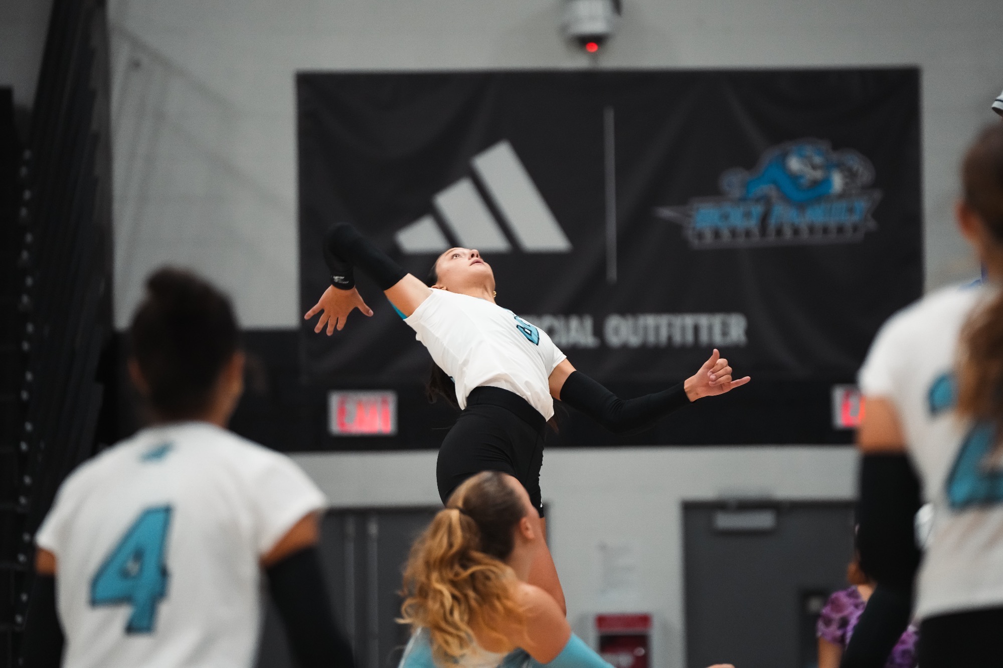 Gianna DiPilato in the air, about to attempt an attack