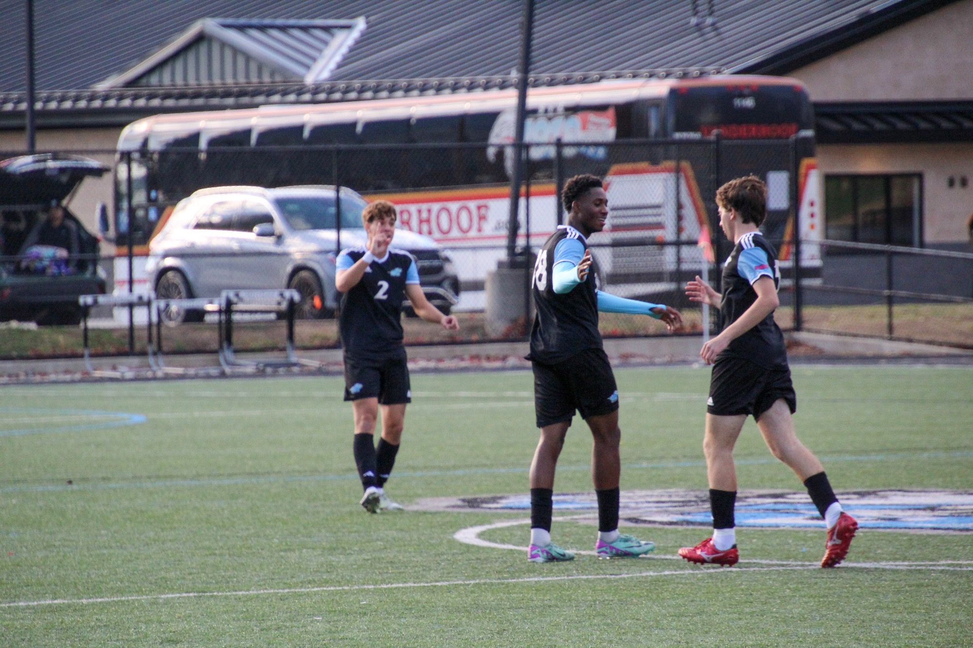 Corey Yorke extends his right hand out to high five a teammate