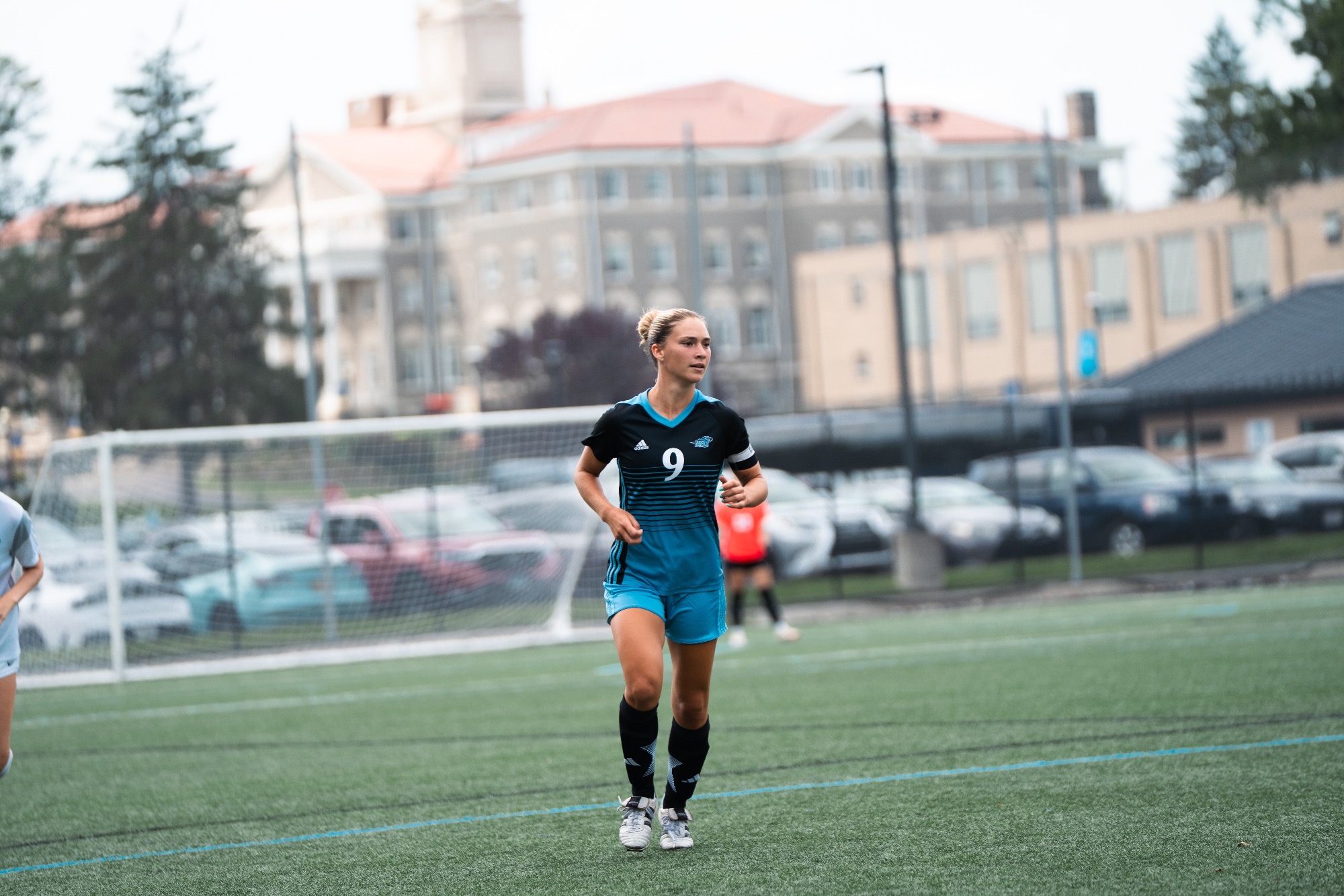Bridget Dickson jogs on the field