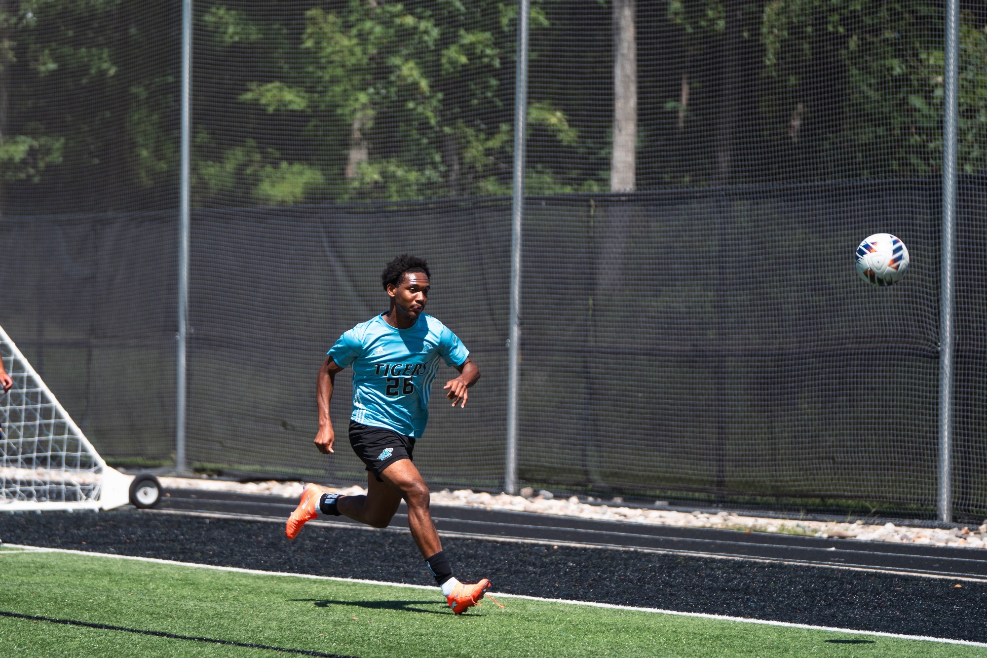 Chamar Blanchard runs after a bouncing ball