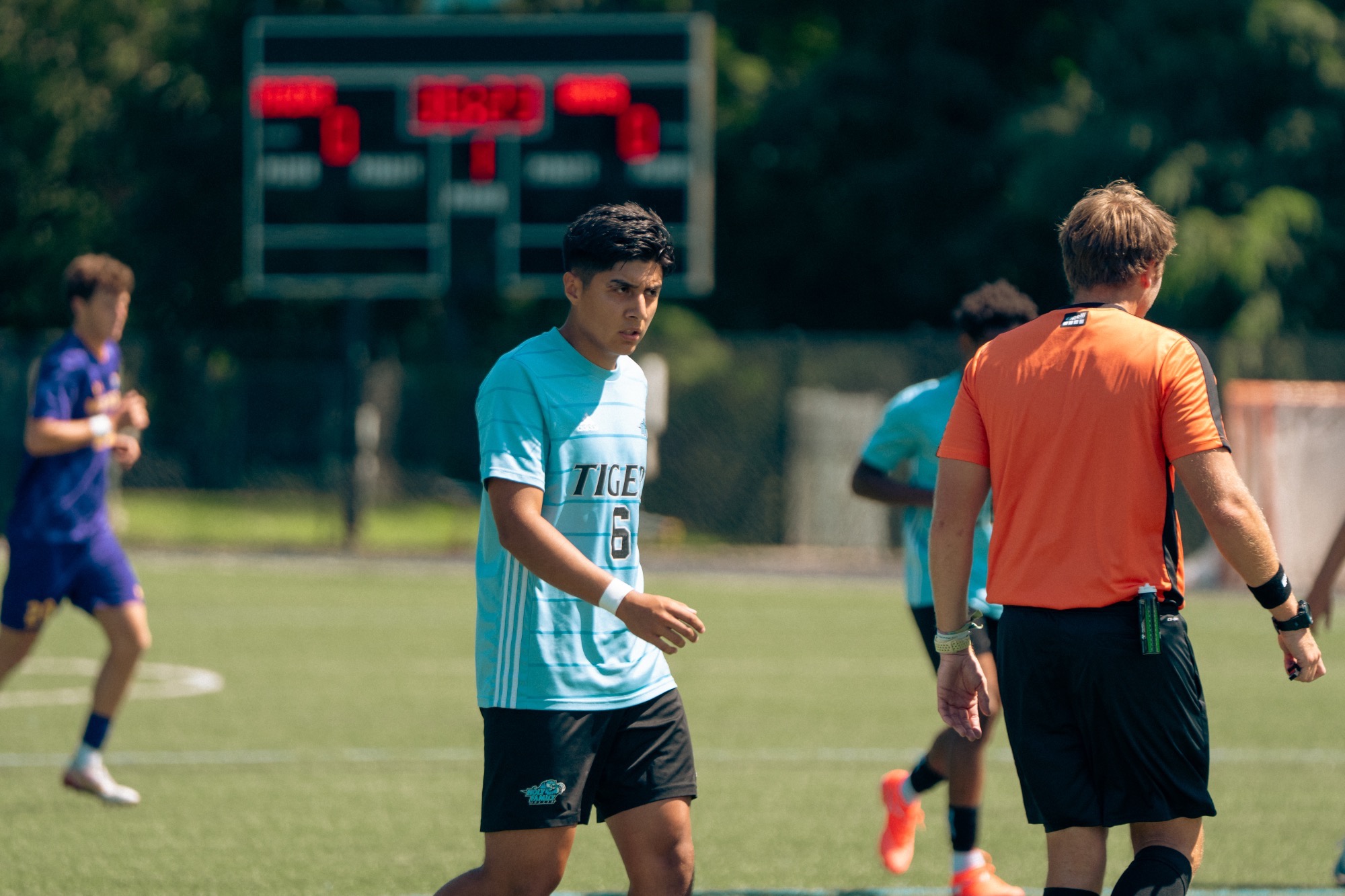 Kevin Castro walking on the field, a focused look on his face