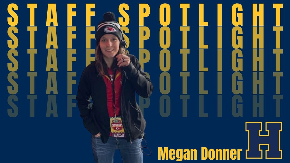 Megan Donner wearing her headset and Chiefs gear. 