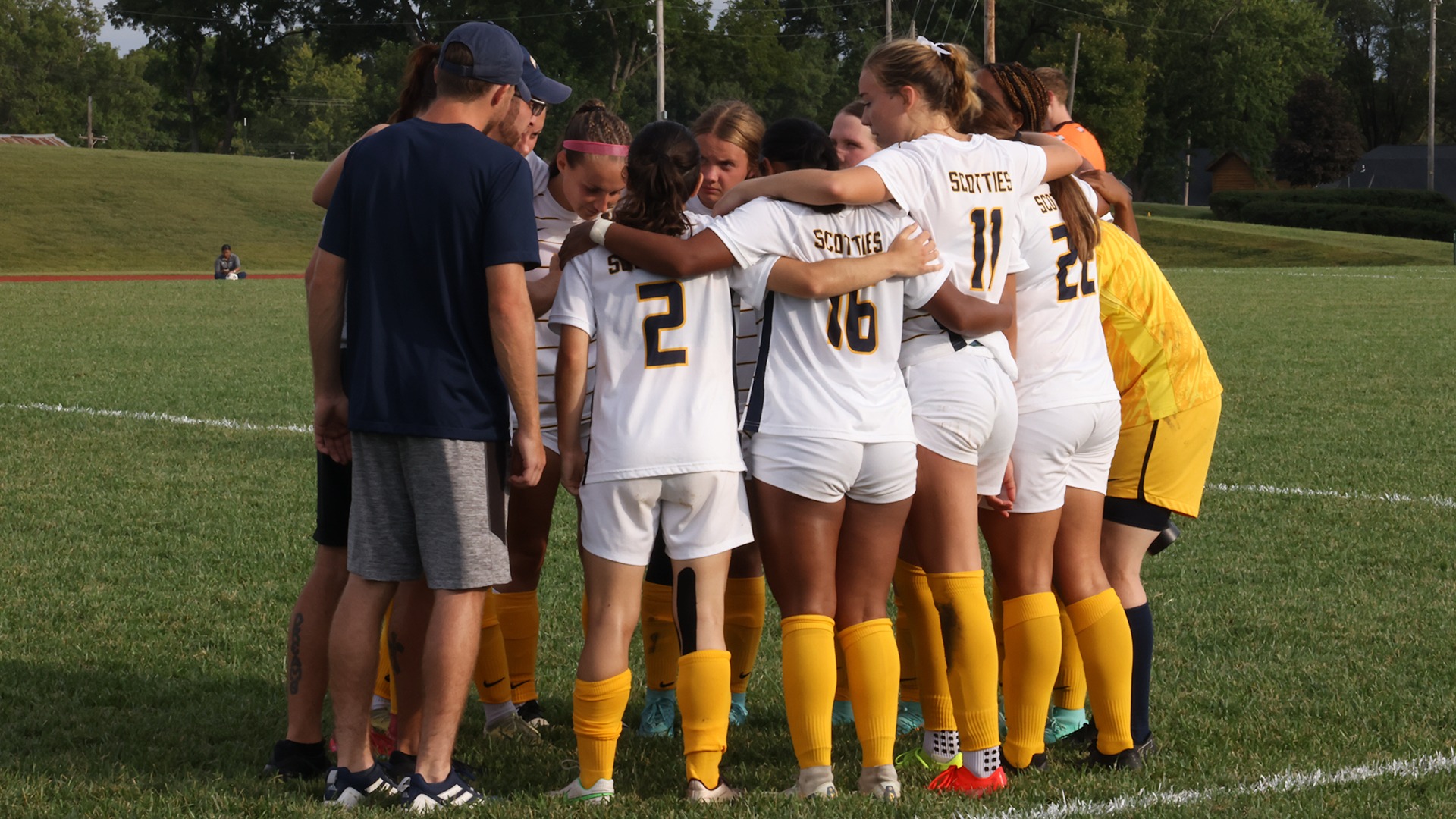 Head coach Jordan Maska giving the Scotties last-minute instructions before kickoff against Kansas City (Kan.) Community College on Sept. 20