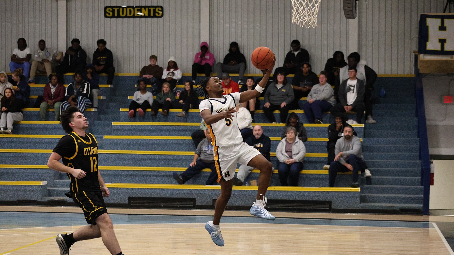 Adriel Smith makes a fast-break layup in an HCC win over Ottawa