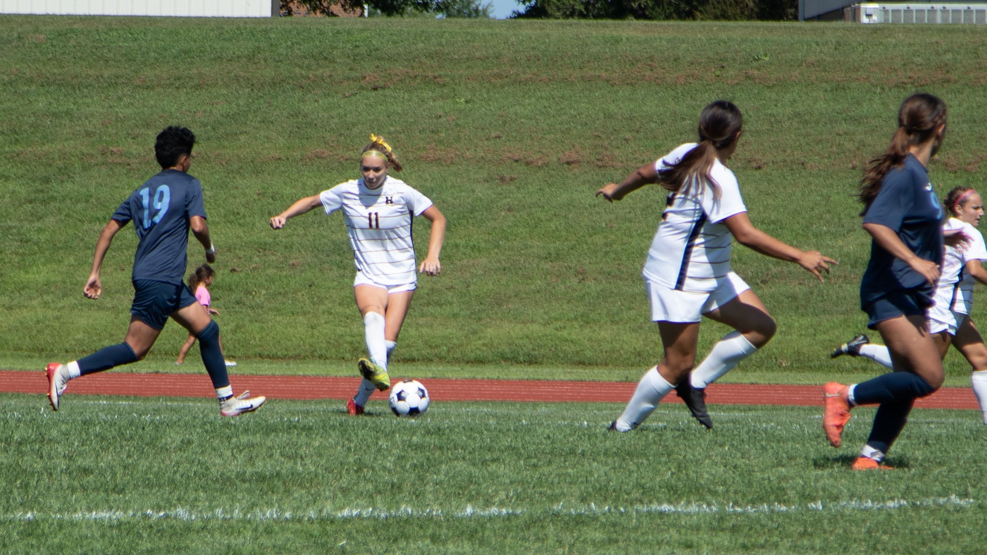 Paige Carrier plays the ball upfield against State Fair Community College
