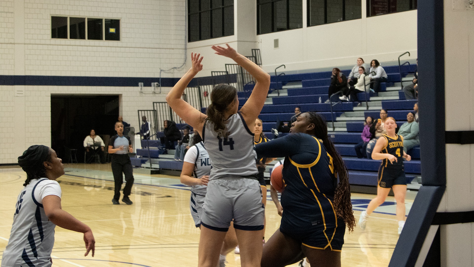 Shamiah Johnson battles through contact to make a layup at Metropolitan Community College - Kansas City