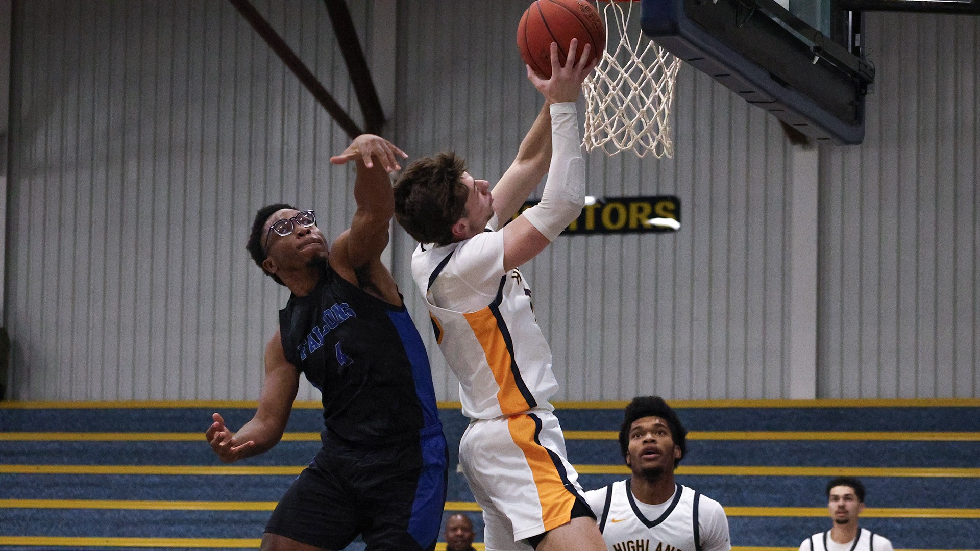 Colton Knoll eludes a Kansas Christian defender on his way to the basket.