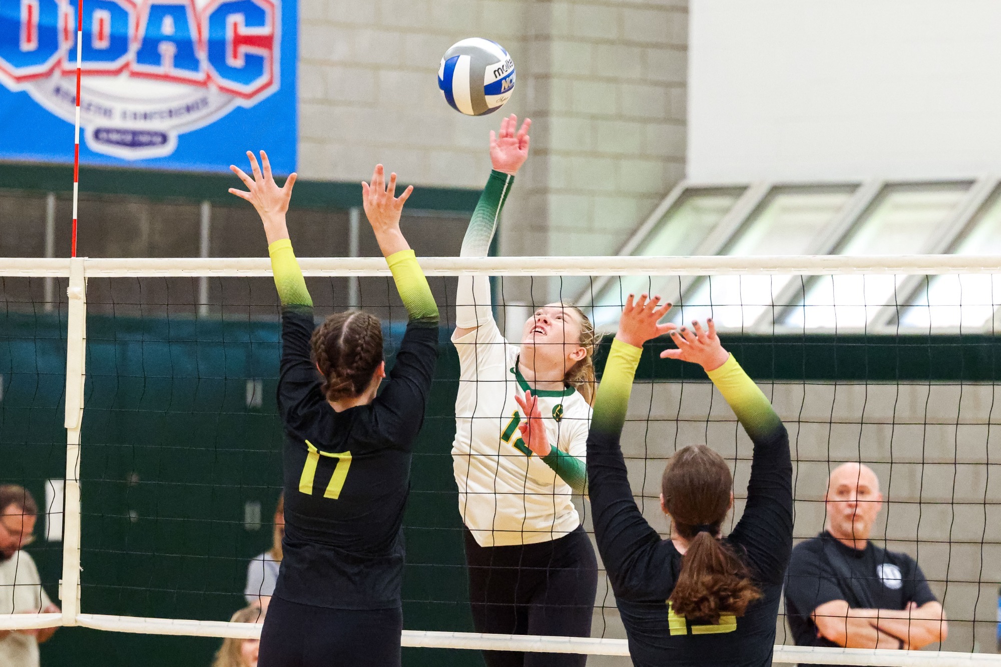 Alyssa Reed with the attack over two defenders