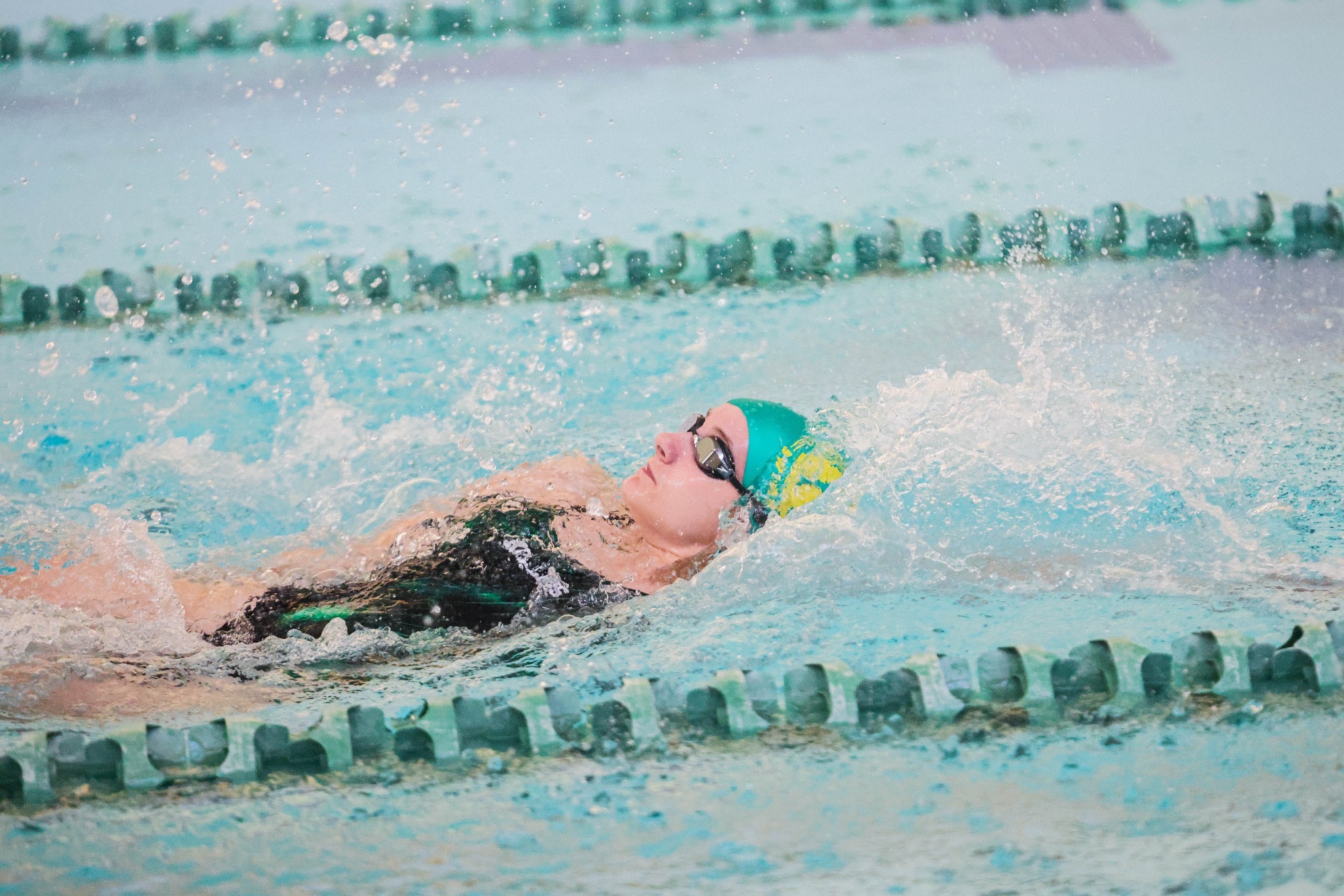 Hollins swimmer in the backstroke