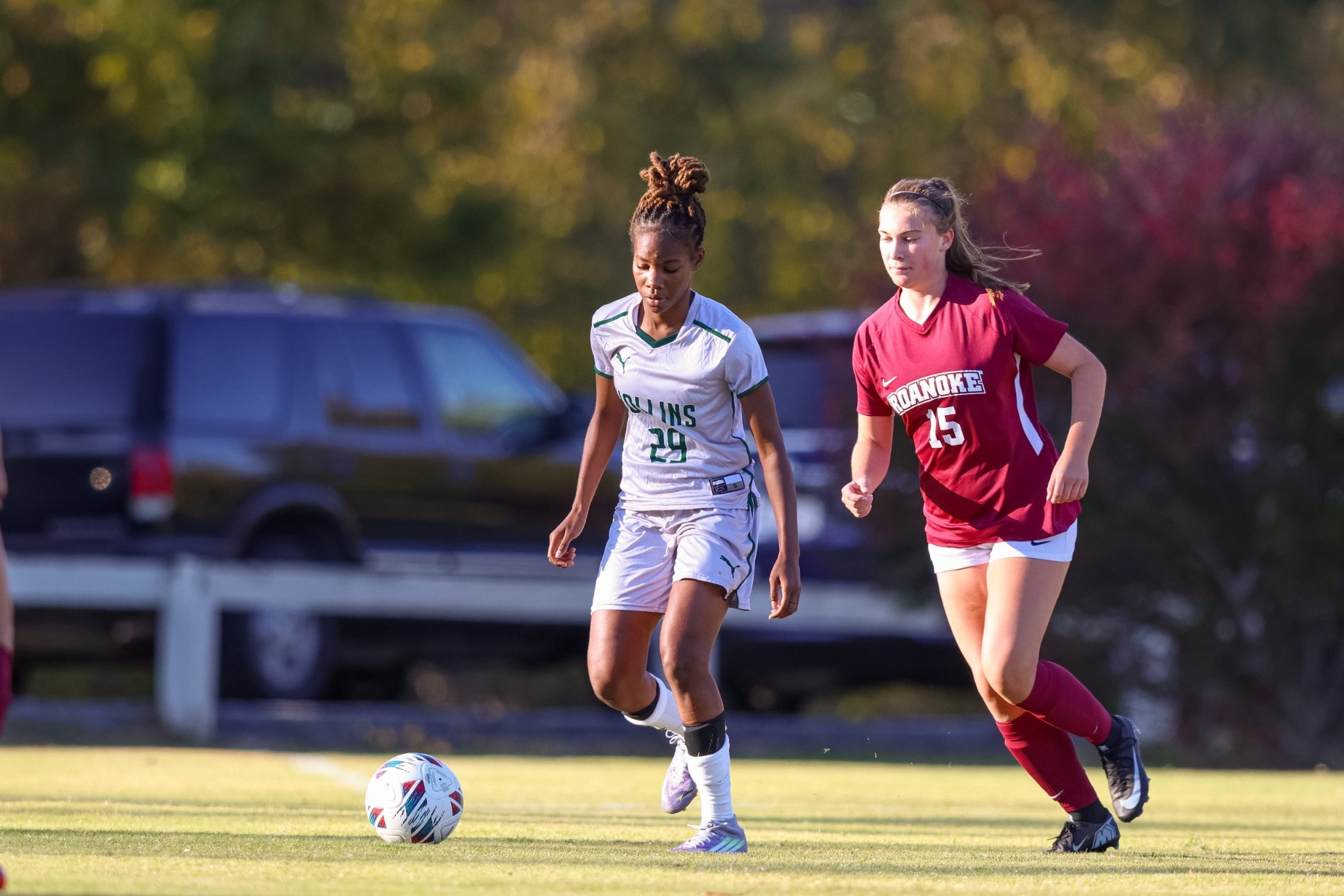 Raynia Russell against a defender
