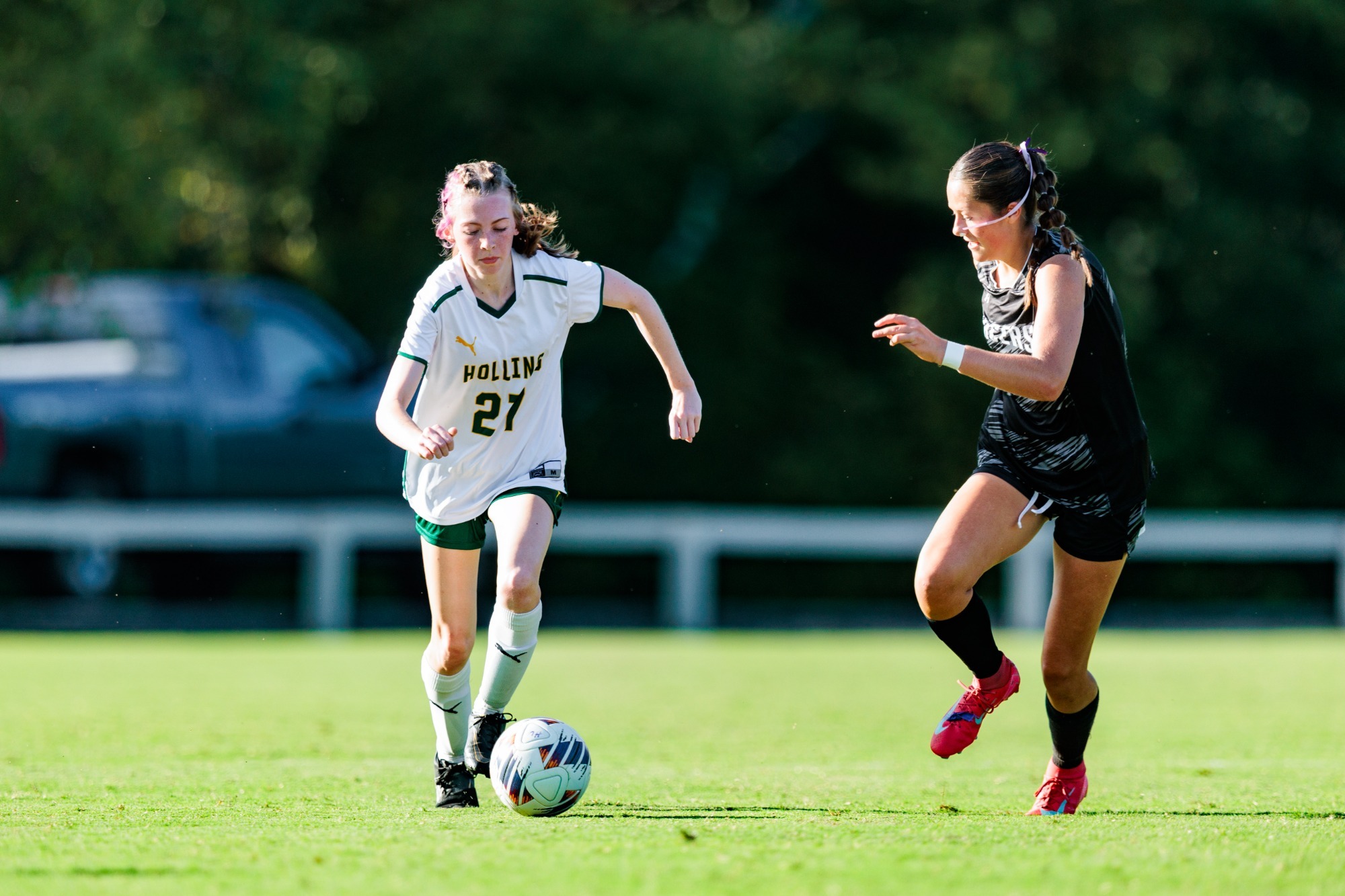Caylie Nichols racing to the ball against a defender