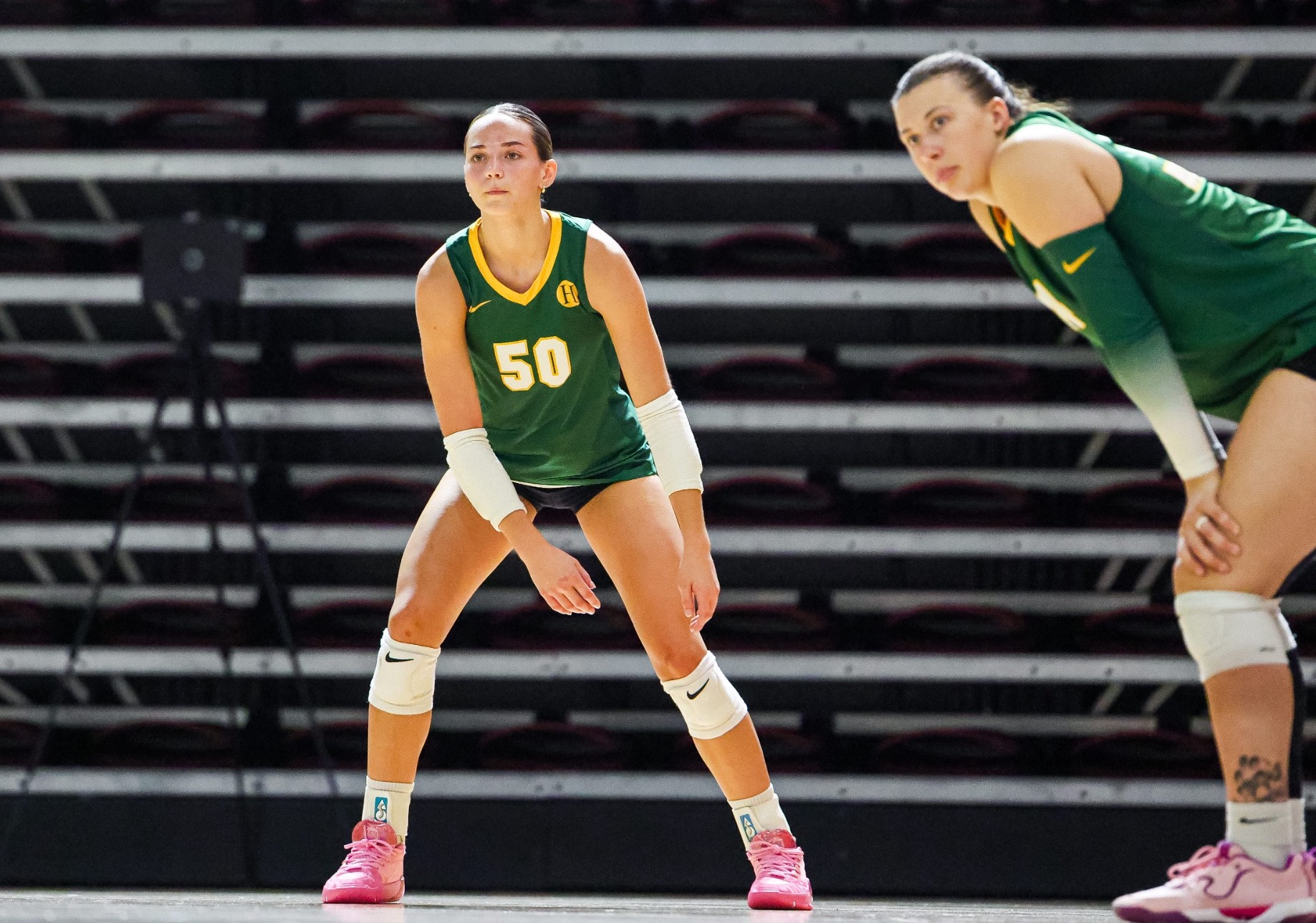 Annabelle Kemper and Cassidy Henderson await the serve