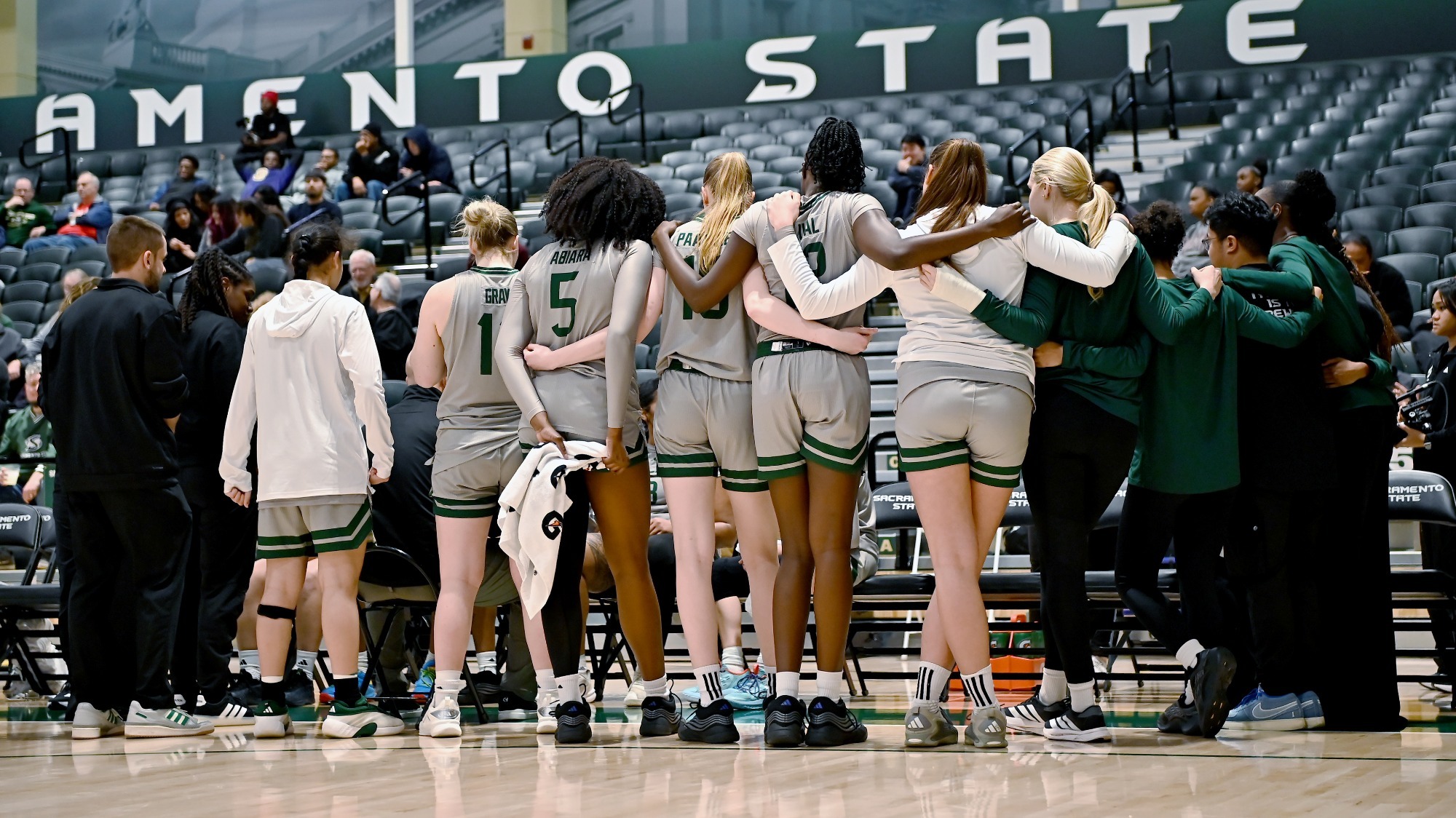 2025-26 WBB Team huddle during a timeout against Simpson University