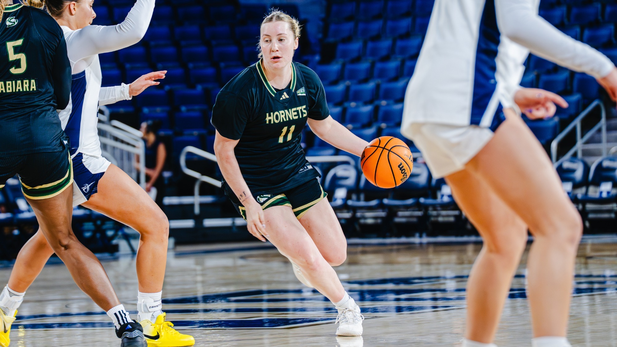 2025-26 WBB Rubi Gray drives against a California Baptist defender