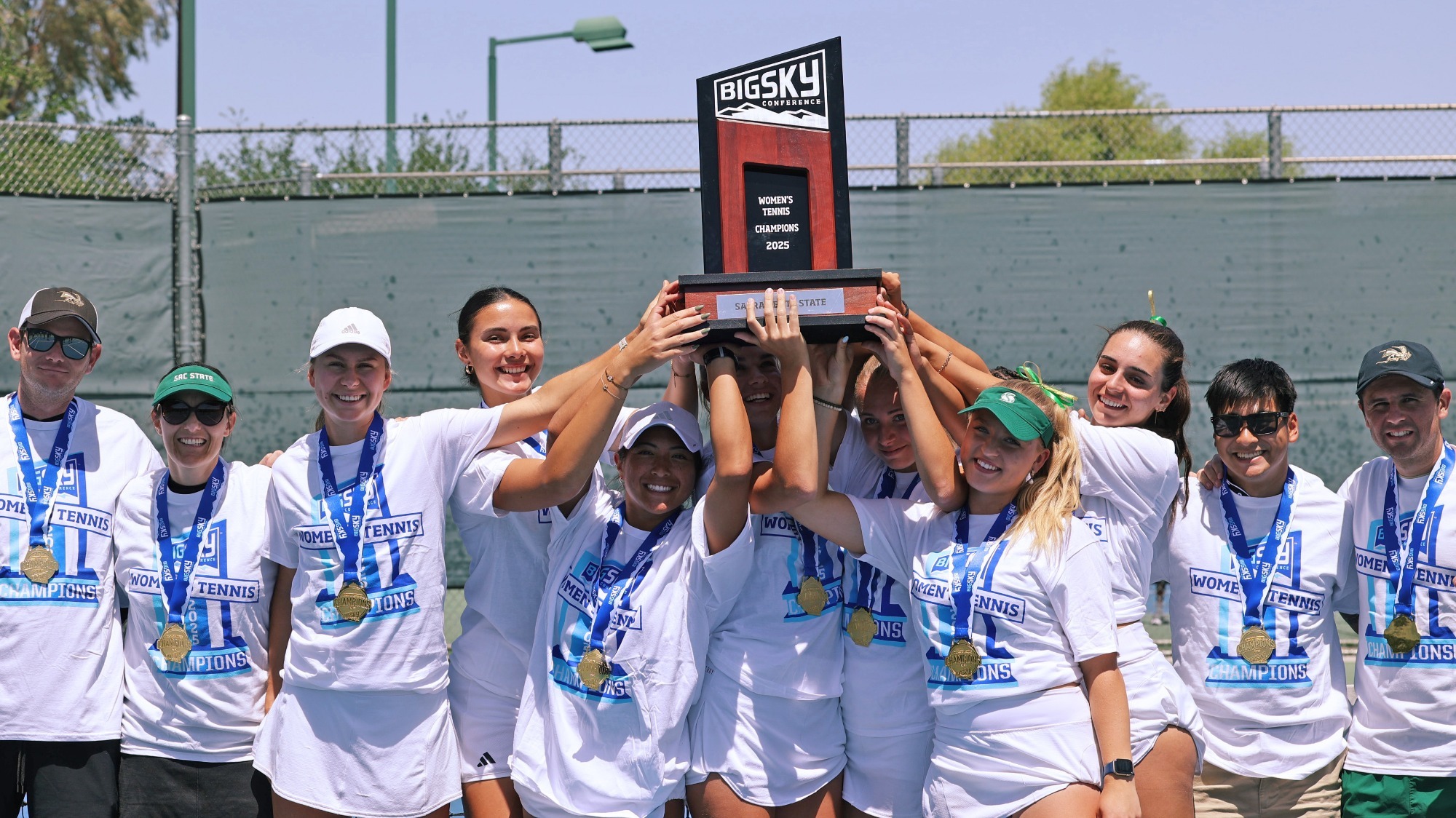 2025 WTEN Big Sky Tournament championship team photo with the trophy raised in the air