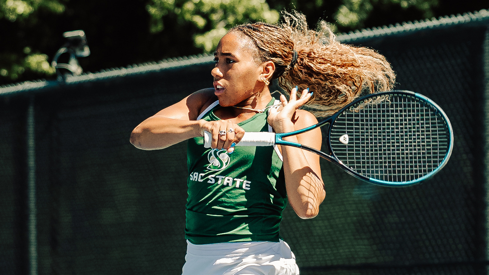 2025-26 WTEN Reese Walker hits a forehand in a match against Portland State