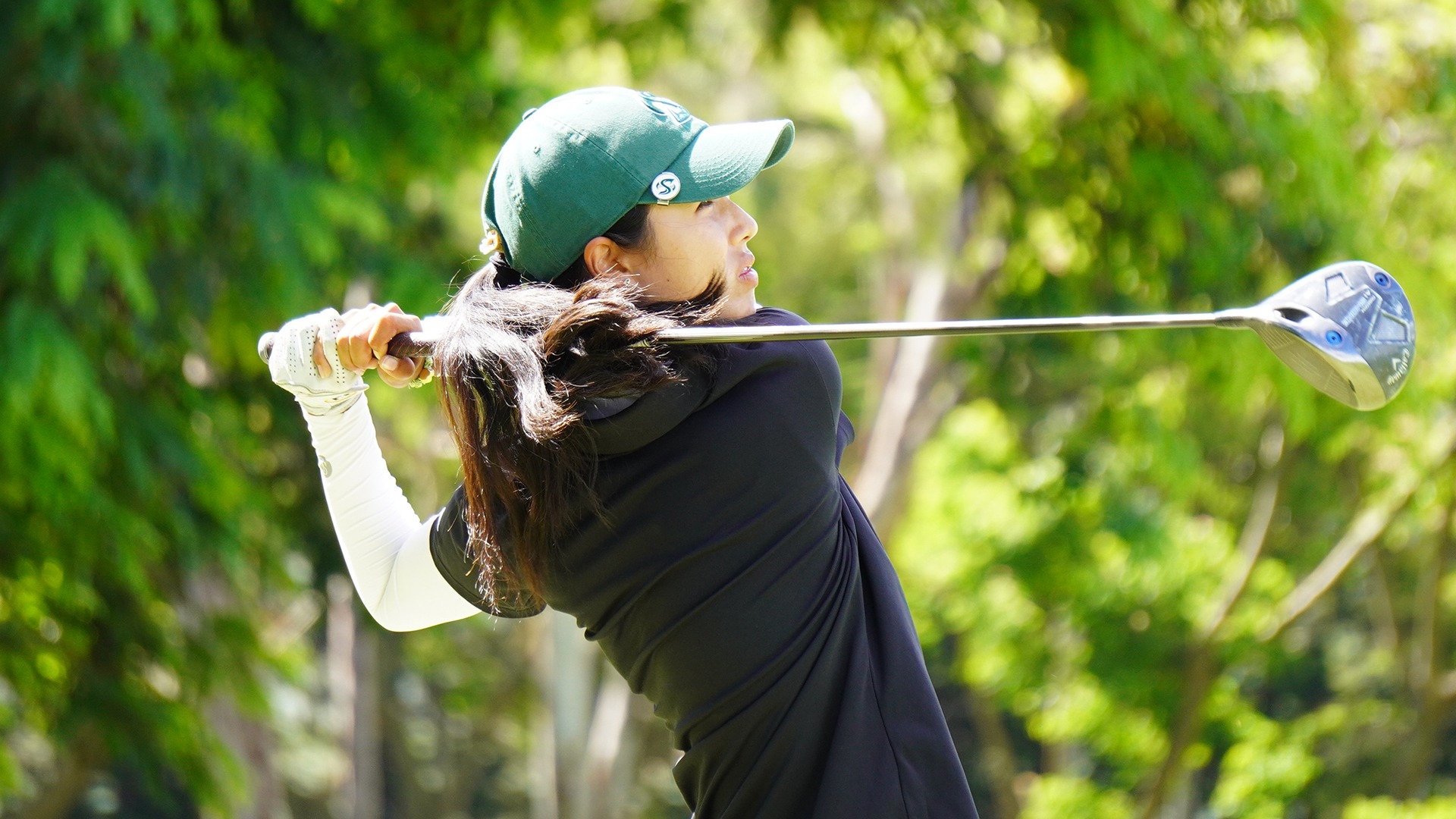 Photo of Sophia Lee following through after a drive