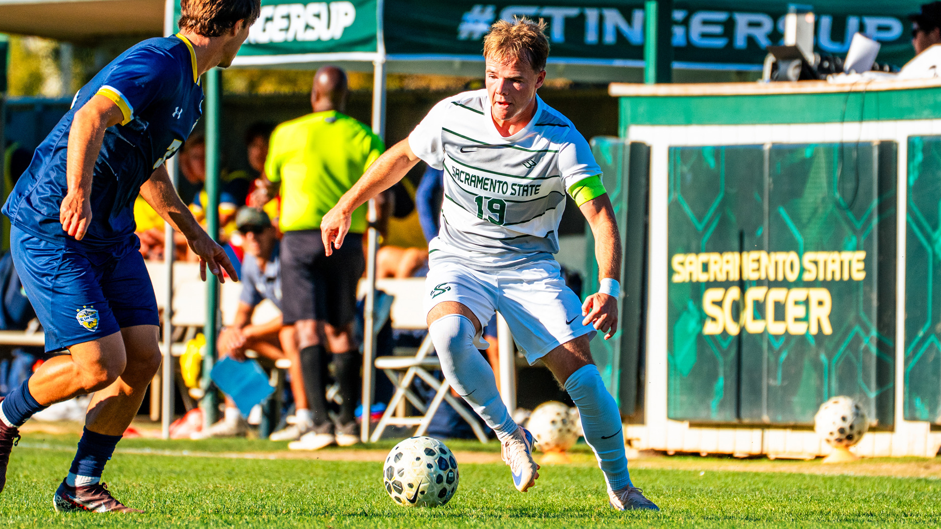 2026 MSOC Zac Giles dribbles against a UC San Diego defender in a match at home earlier this year