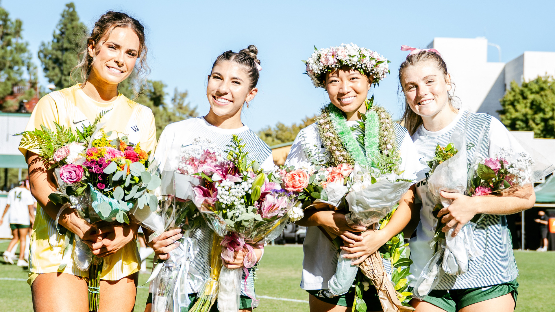 2026 WSOC Seniors Hayley Hartsburg, Lexi Schroeder, Candace Ching, and Ellie Farber pose for a photo together during Senior Day festivites prior to kickoff against CSUN