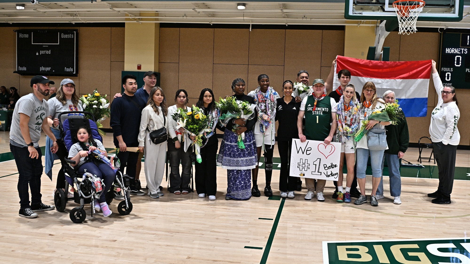 2025-26 WBB Seniors, family and friends pose for a photo as part of 