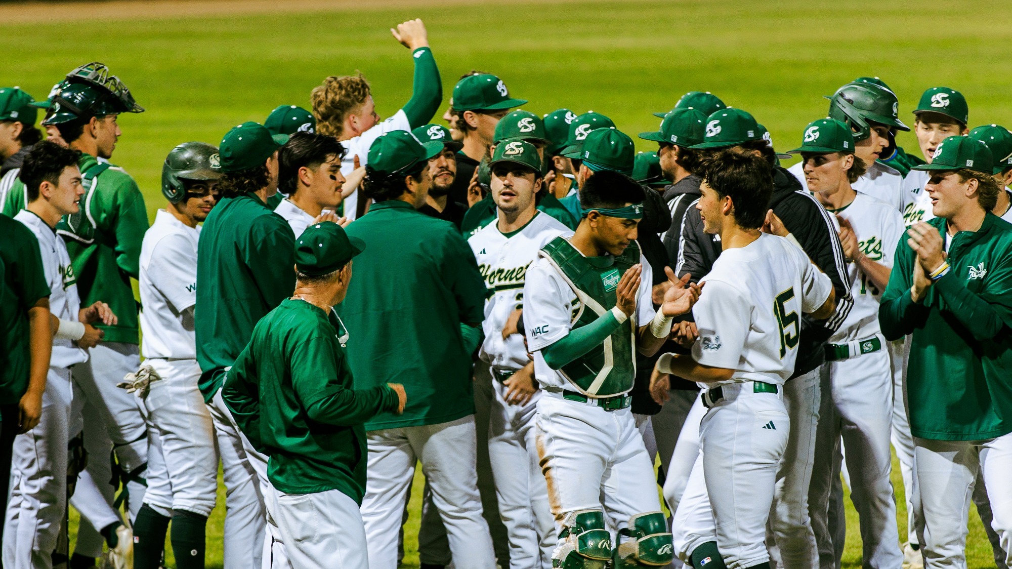 2026 BSB The Hornets celebrate breaking the huddle following a victory over Pacific on March 11 at home