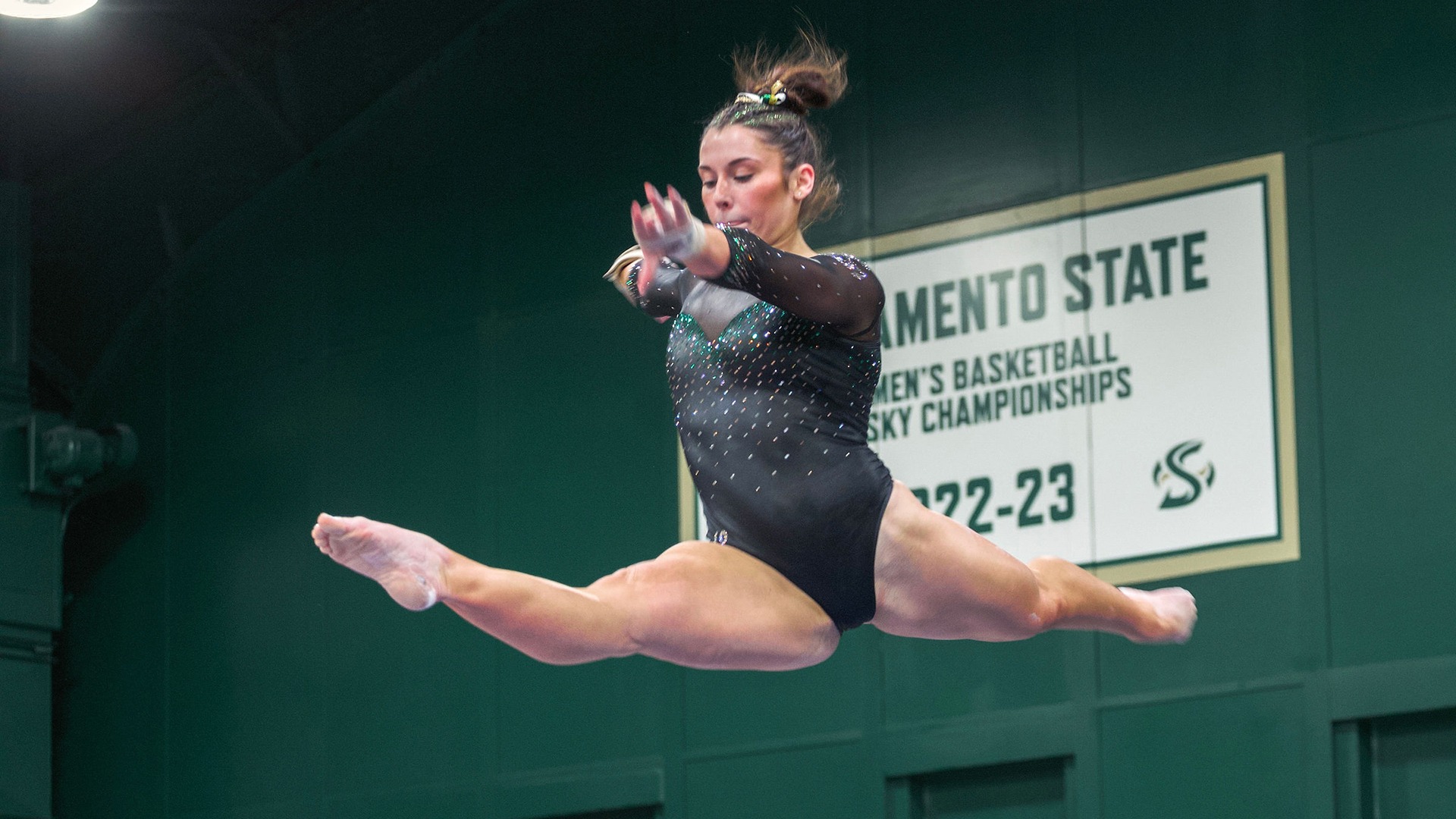 Kaitlyn Driessen performs a leap on balance beam