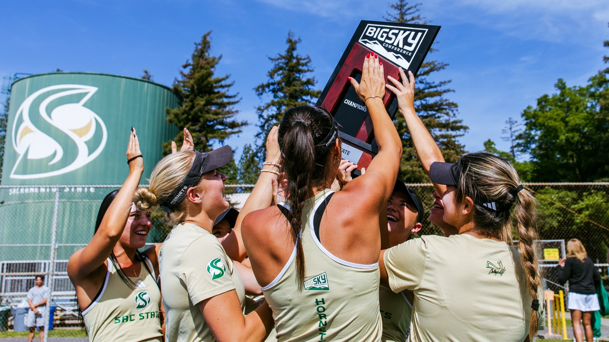2025-26 WTEN The Sacramento State women's tennis team hoists the Big Sky Conference trophy after claiming the regular season title outright