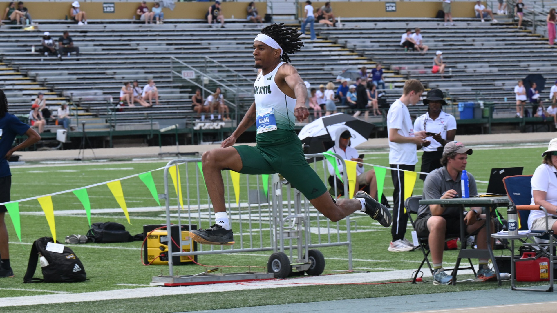 Photo of Kellan Quinley mid jump in the triple jump