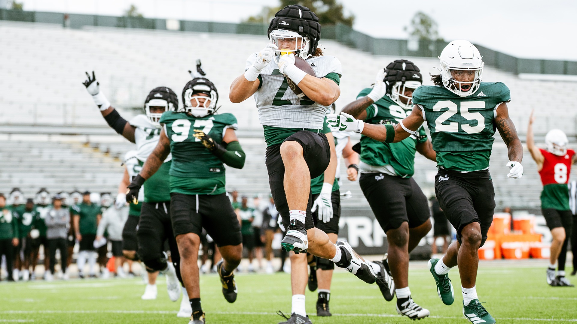 Photo of Elias Brown rushing for a touchdown in the spring game
