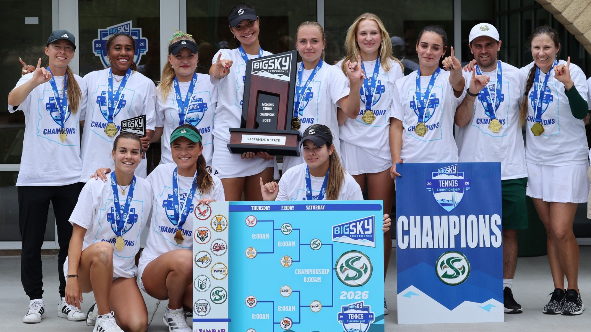 2025-26 WTEN Sacramento State team photo with the Big Sky Tournament trophy, the final bracket, and a champions banner with the Sac State logo
