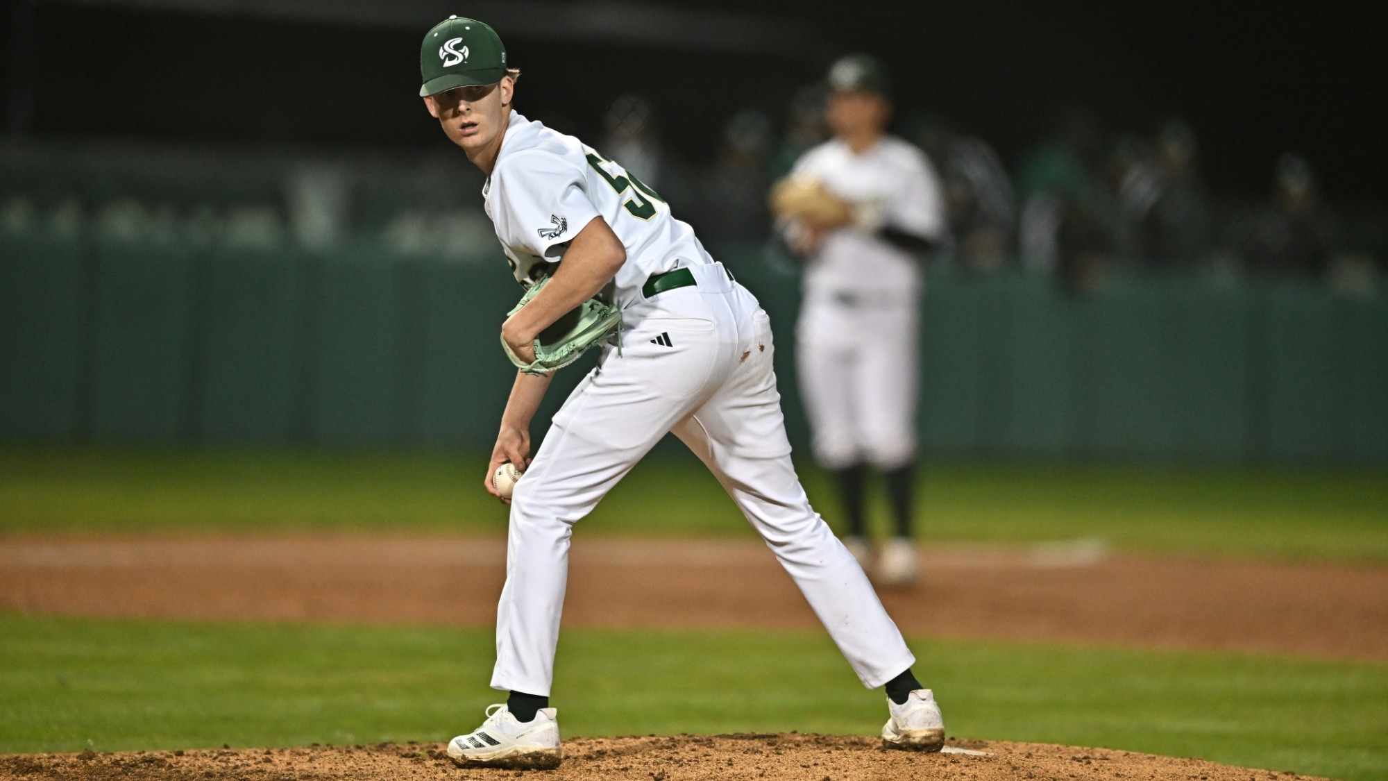 2026 BSB Trevor Wilson checks on a runner at first base during a game against Saint Joseph's on Feb. 20