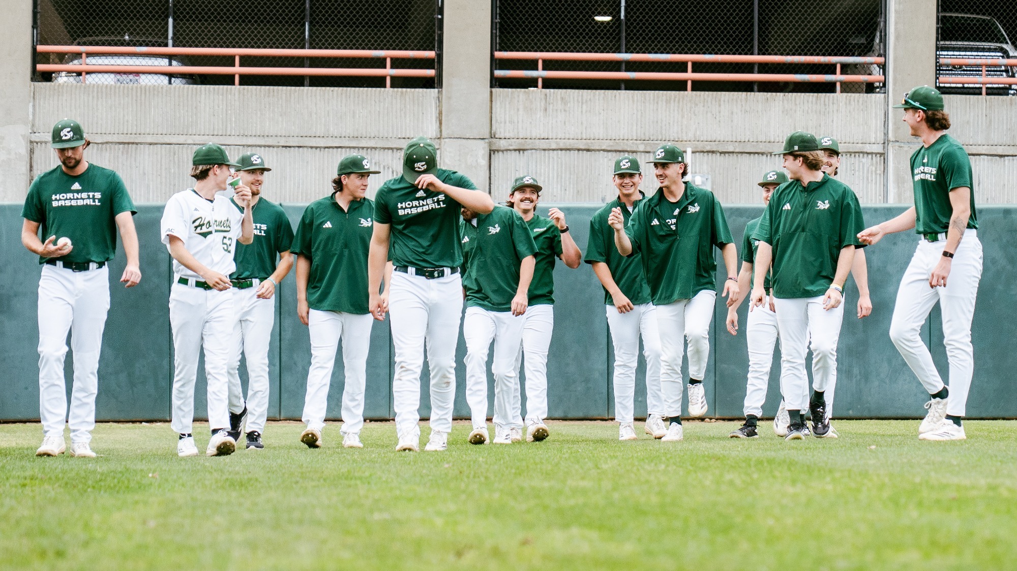 2026 BSB A group of Hornet players walk in from the outfield prior to first pitch of a game against Pacific on March 11