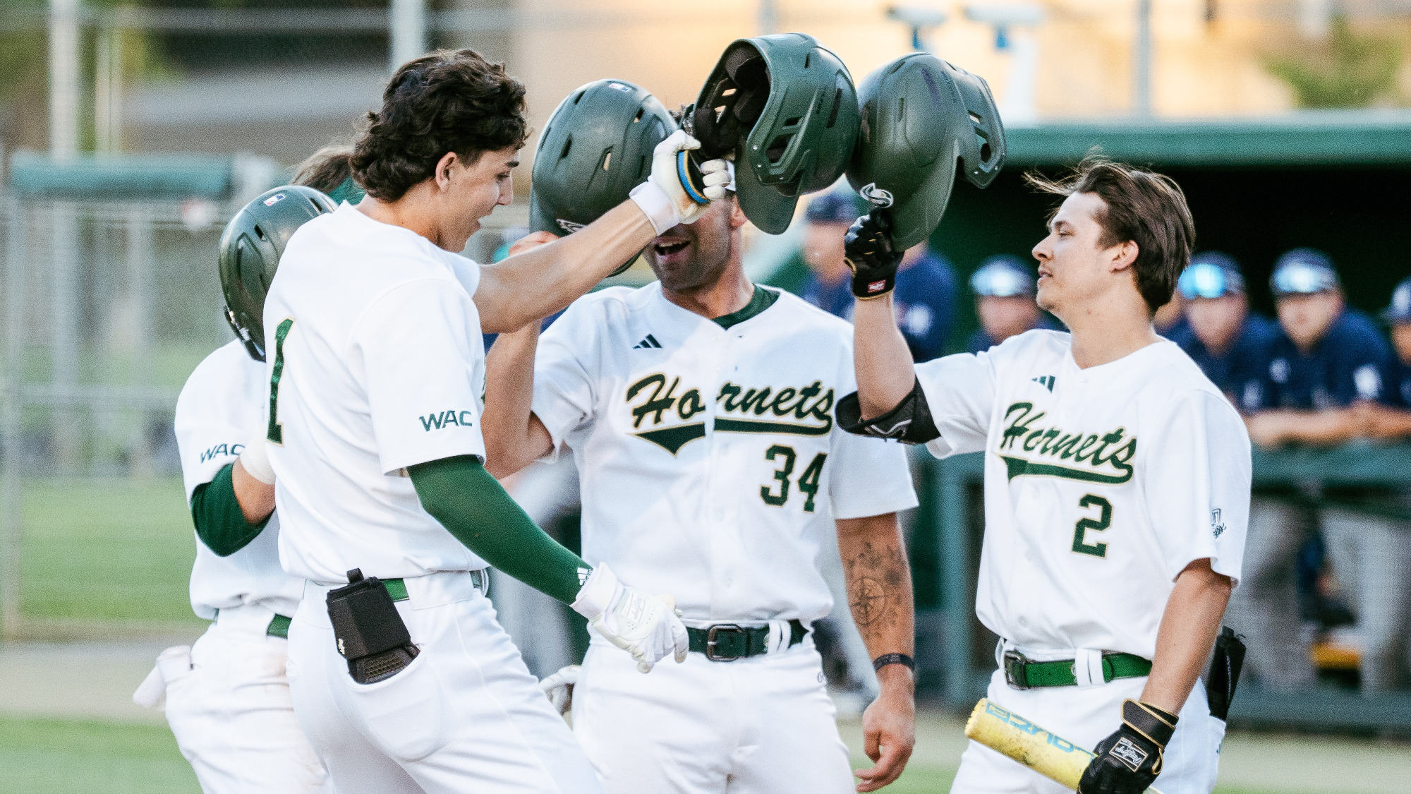 2026 BSB Sam Harry is welcomed by teammates at home plate following one of his two home runs in the win over Nevada on April 6