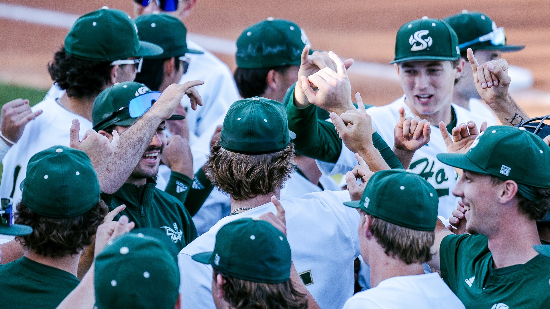 2026 BSB Team huddle prior to first pitch against Fresno State with Stingers Up