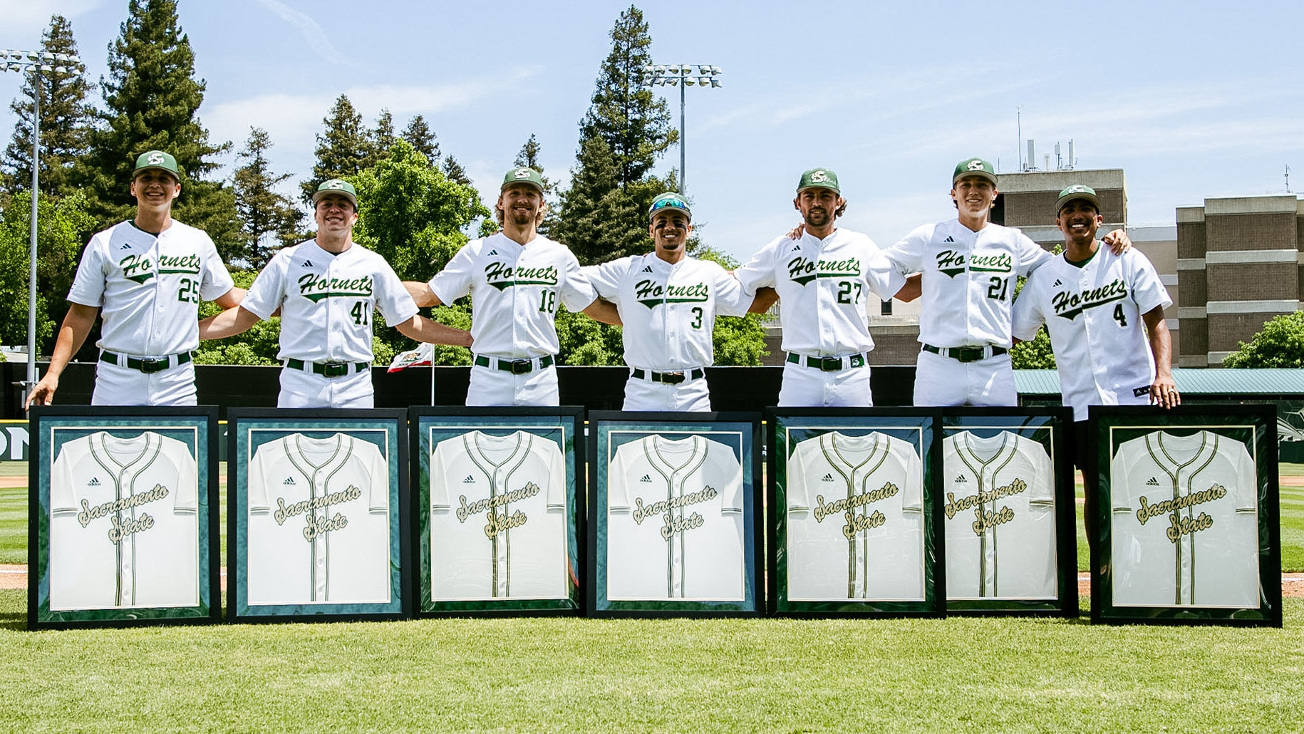 2026 BSB Hornet baseball seniors line up with their framed jerseys along the third base line during pregame 'Senior Day' ceremonies on May 16