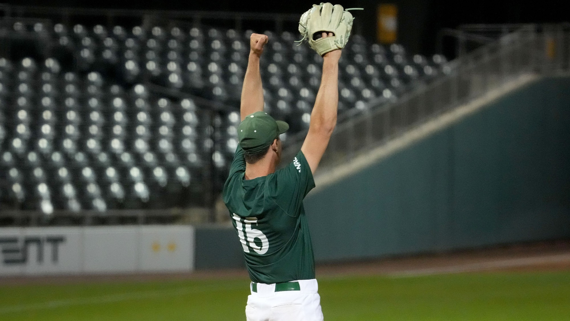 2026 BSB Sean Carey raises his hands in the air triumphantly after the Hornets defeated California Baptist at the WAC Tournament