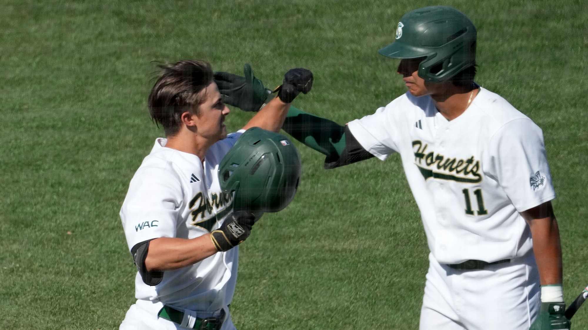 2026 BSB Ryan Ellis is congratulated by teammate Erick Dessens following his home run against Utah Tech in the WAC Tournament on May 22