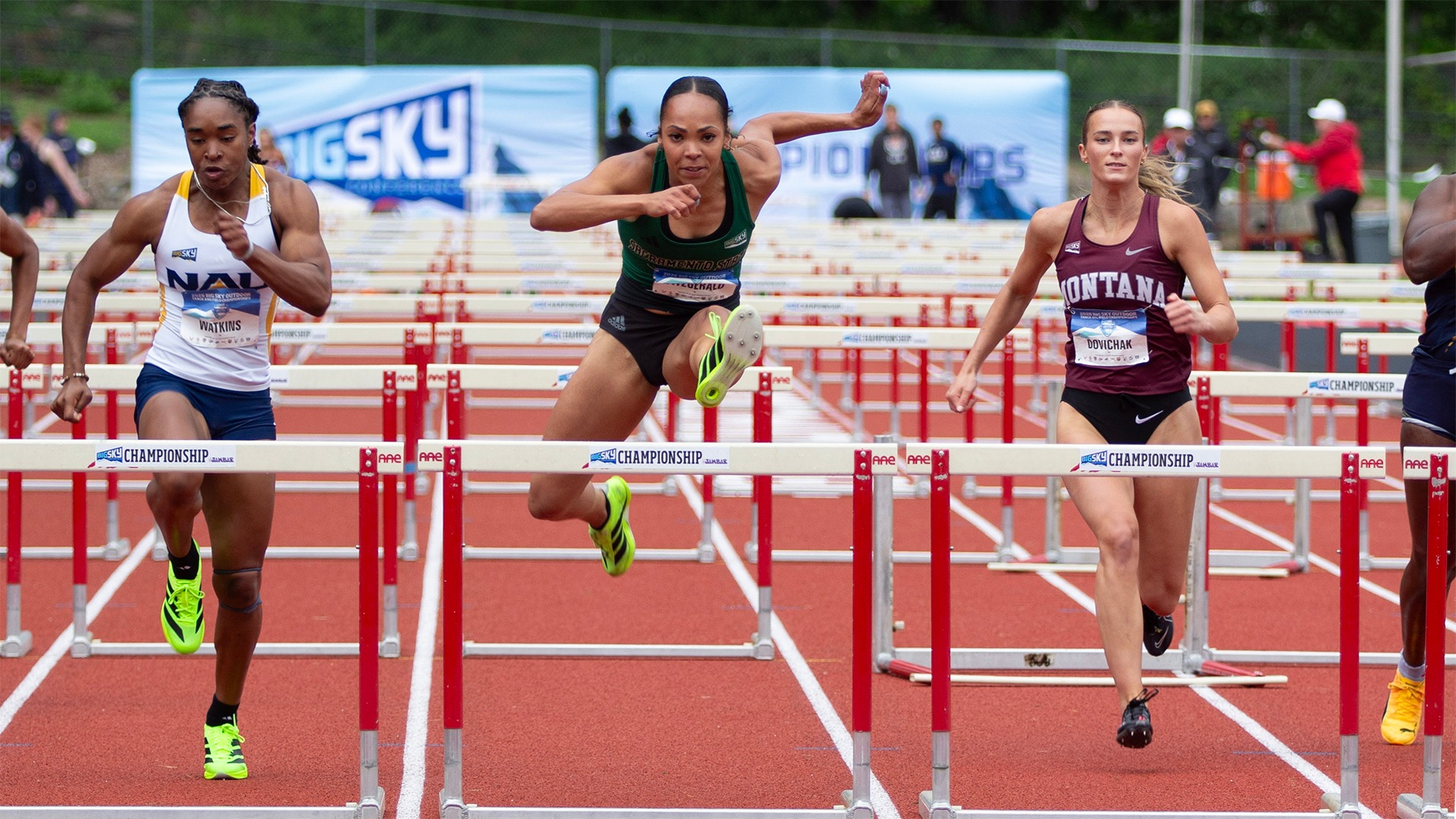 Ava Fitzgerald jumps over a hurdle in a 100-hurdles race
