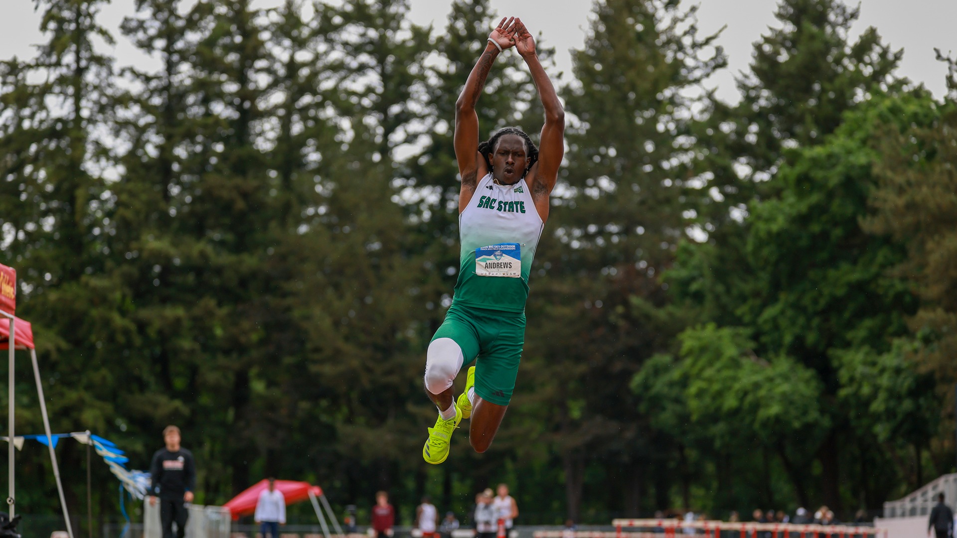 Jamar Andrews flies through the air during a triple jump attempt