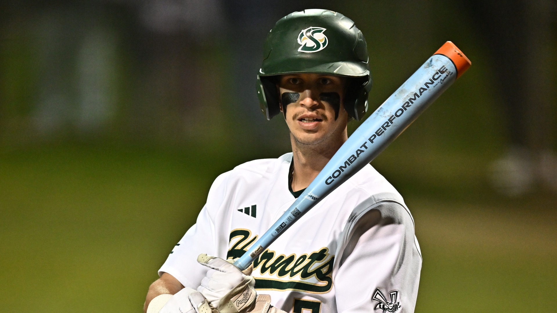 2026 BSB Brett Ott looks to the dugout for the signs during a night game against UC Irvine