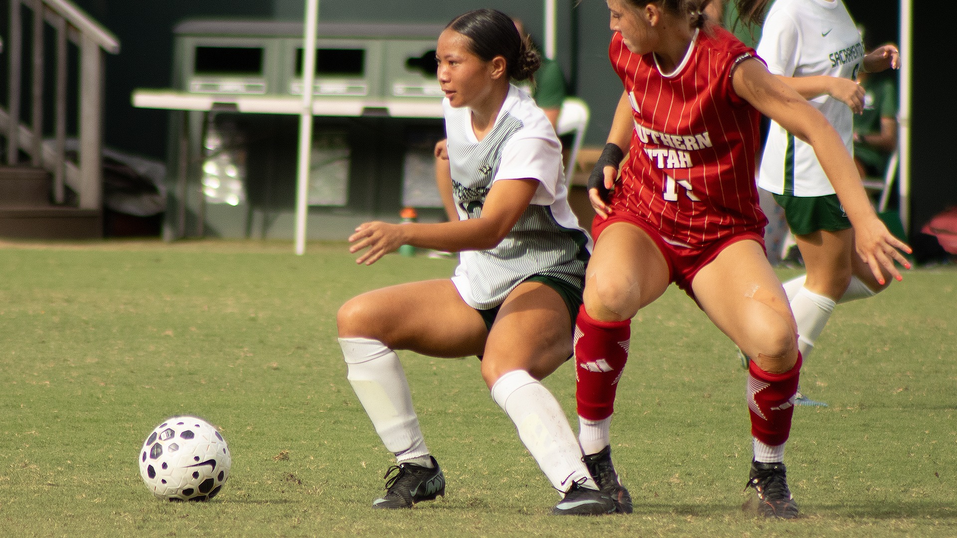 2026 WSOC Candace Ching dribbles the ball against a Southern Utah defender 