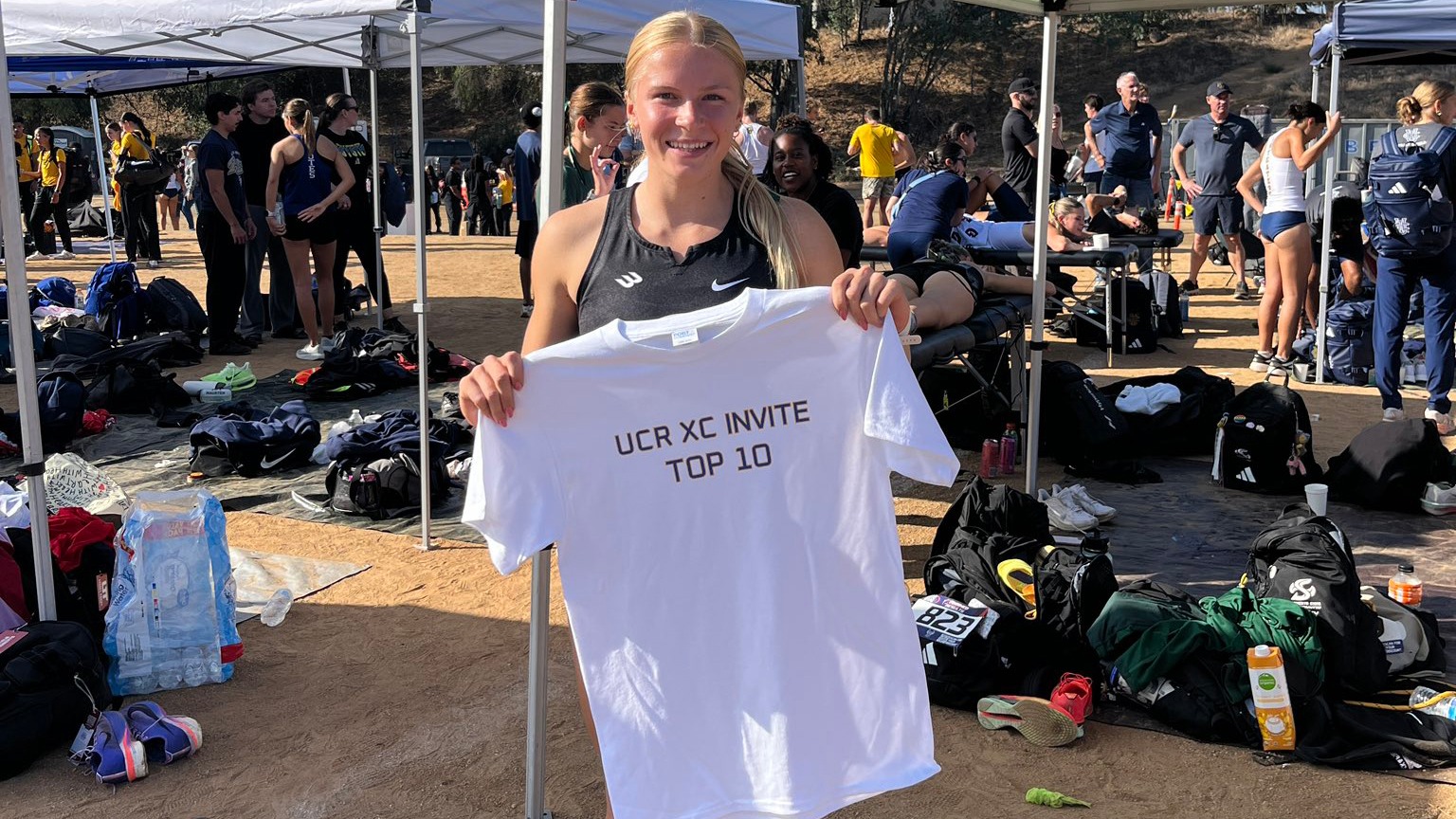 Taylor Wellersdick holds a top 10 t-shirt